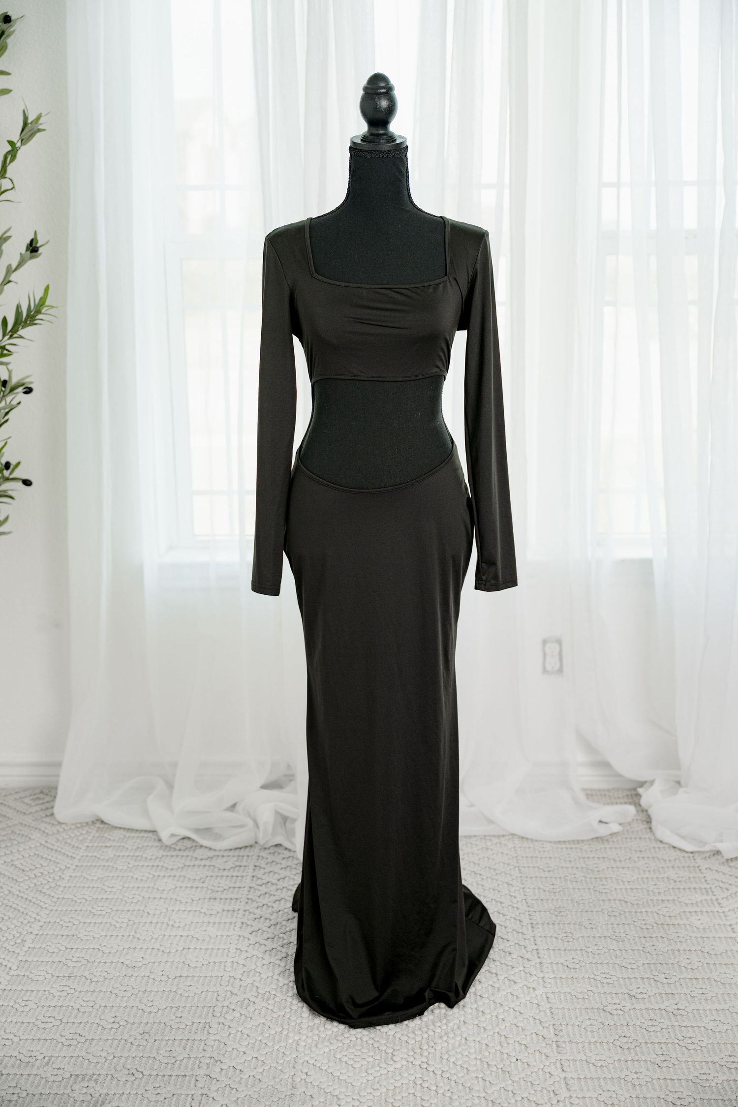Dark olive long sleeve square neck form-fitting maxi dress on a black mannequin.