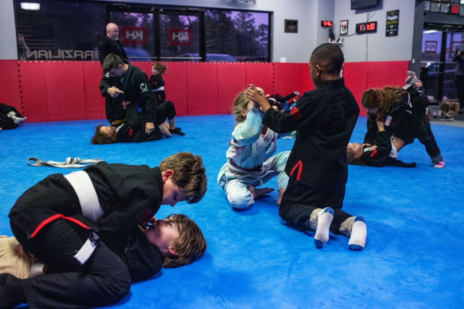 Kids Brazilian Jiu-Jitsu sparring during structured class