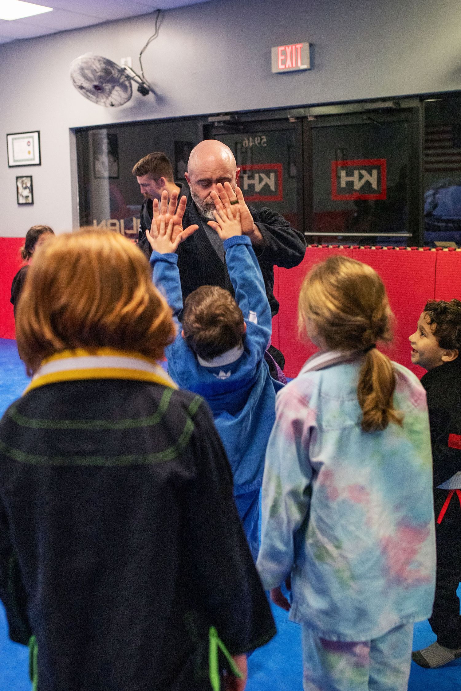 Martial arts instructor teaching kids focus and discipline