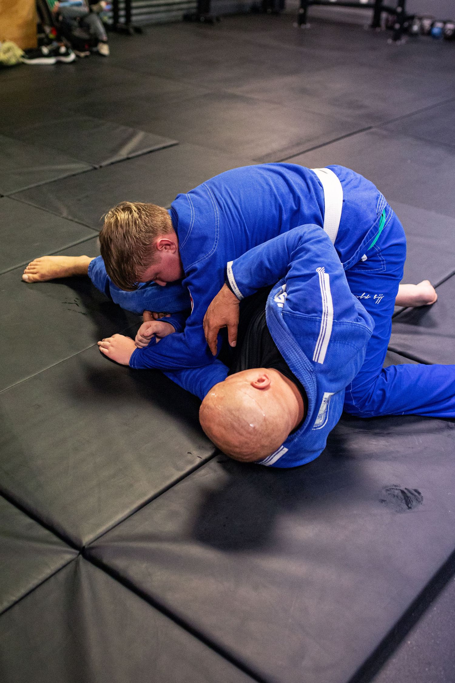 Adult Brazilian Jiu-Jitsu class training at martial arts academy in Rincon, Georgia