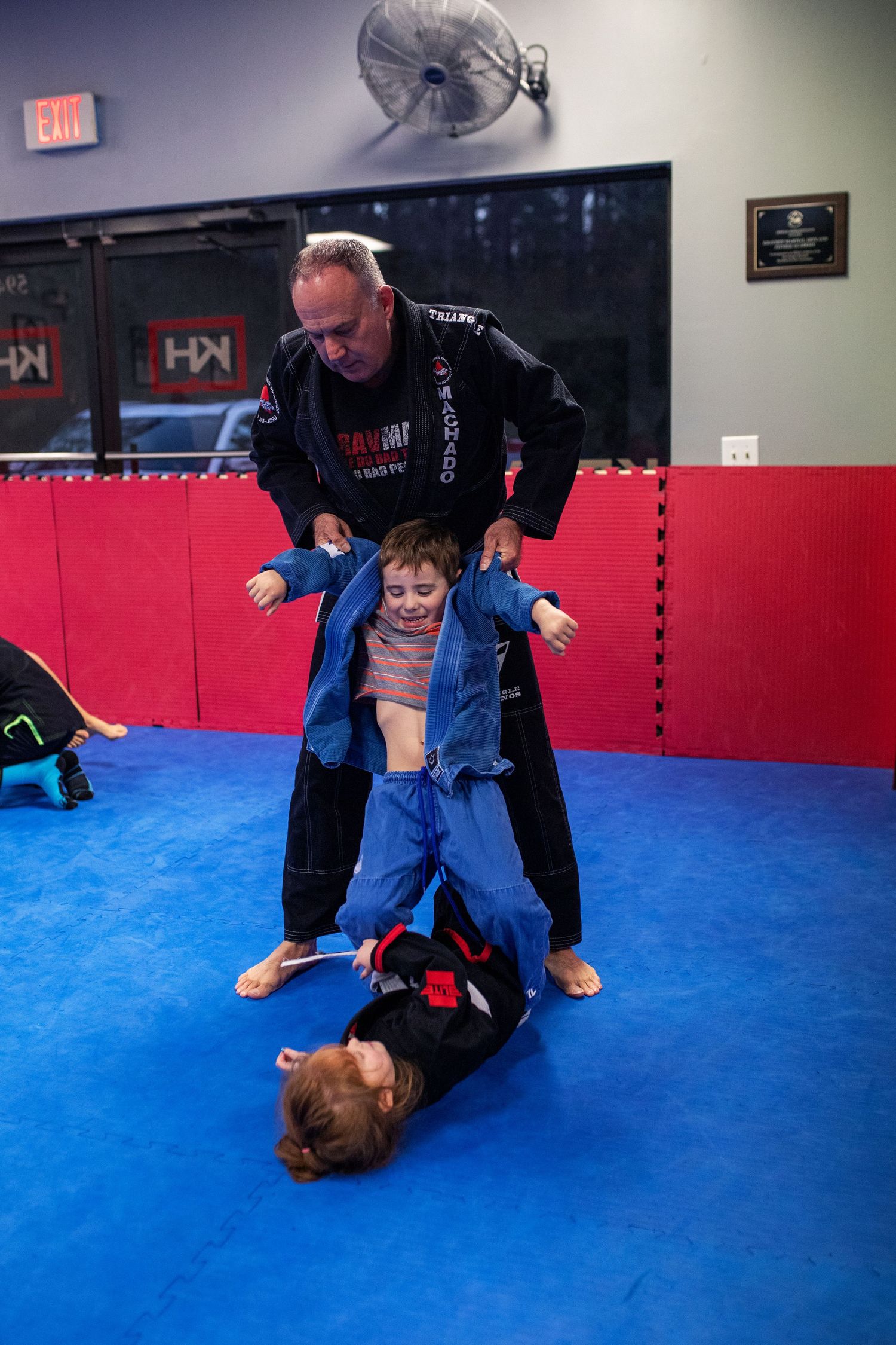 Martial arts instructor teaching kids focus and discipline