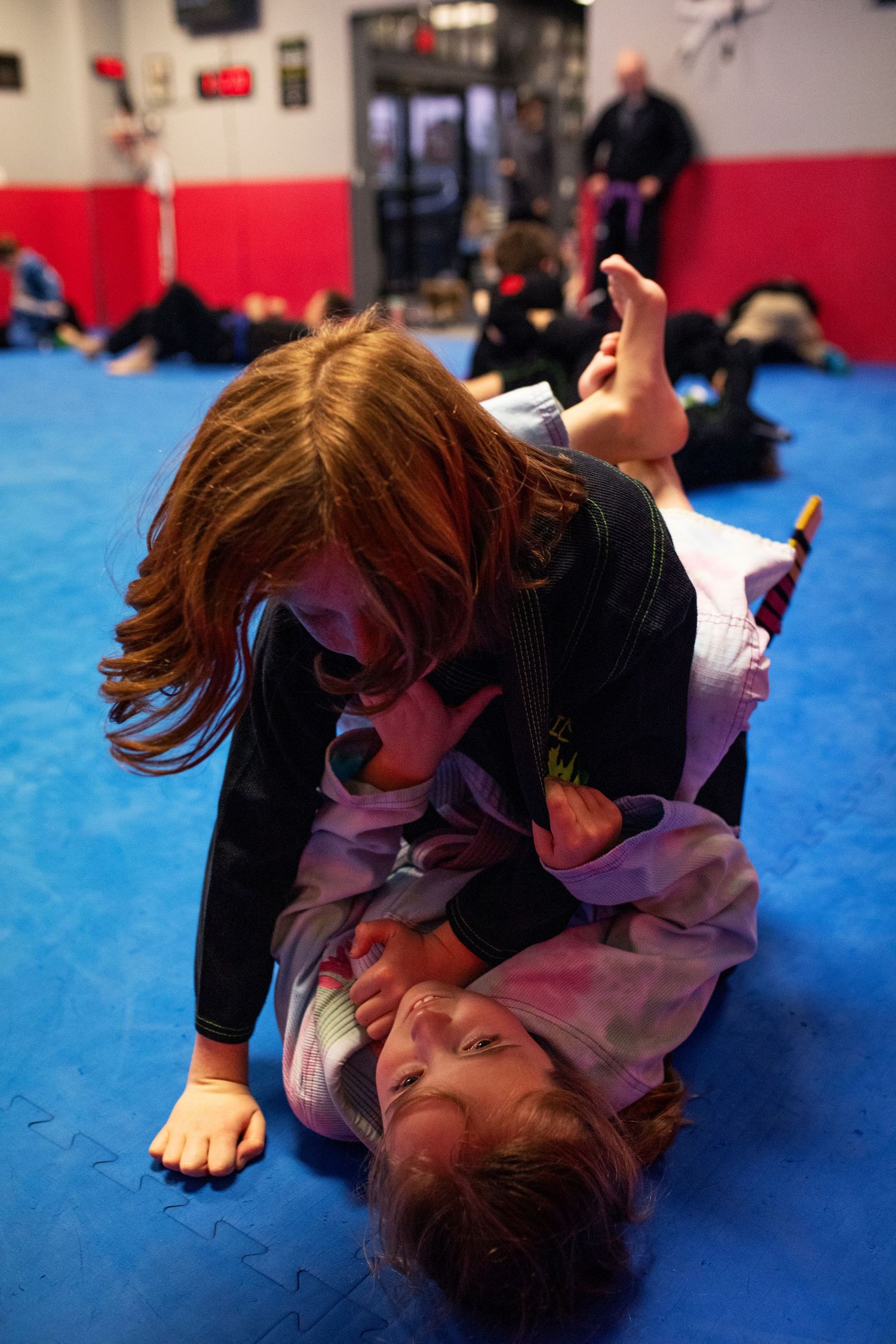 Kids Brazilian Jiu-Jitsu sparring during structured class