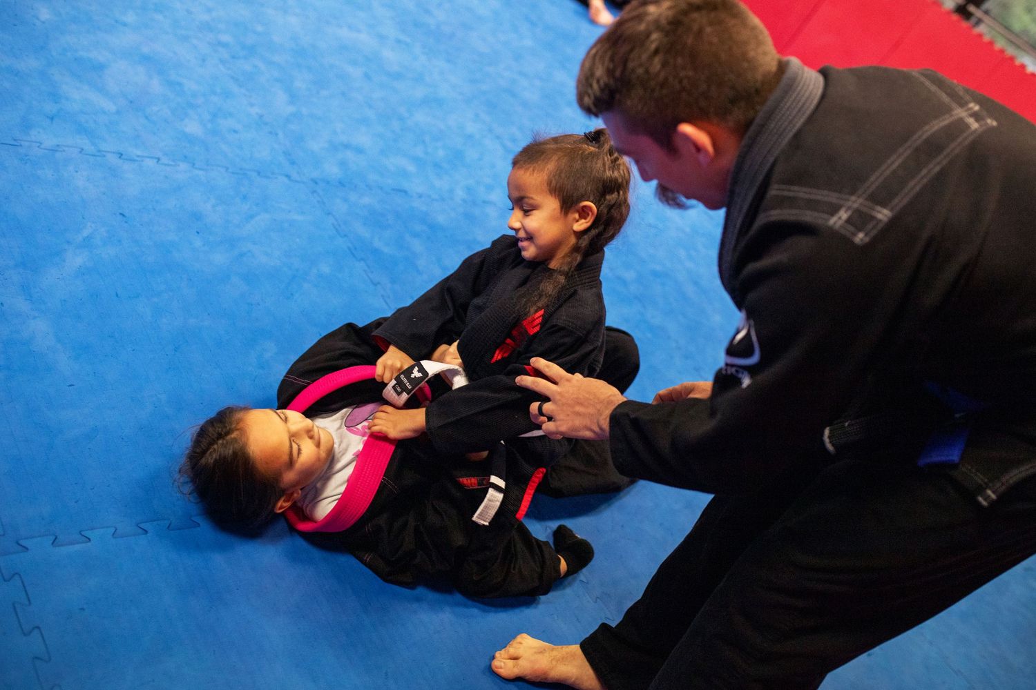 Martial arts instructor teaching kids focus and discipline