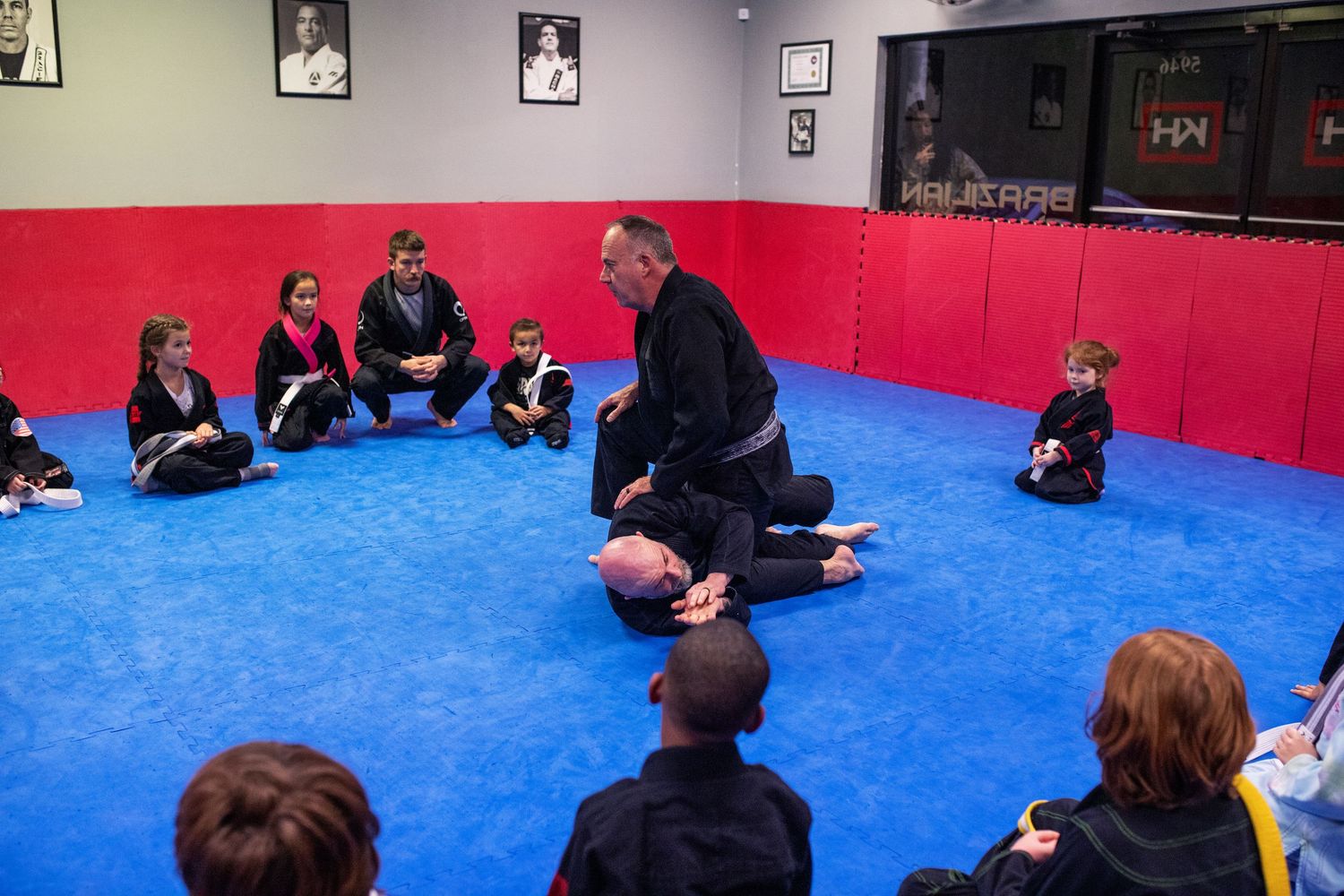 Martial arts instructor teaching kids focus and discipline