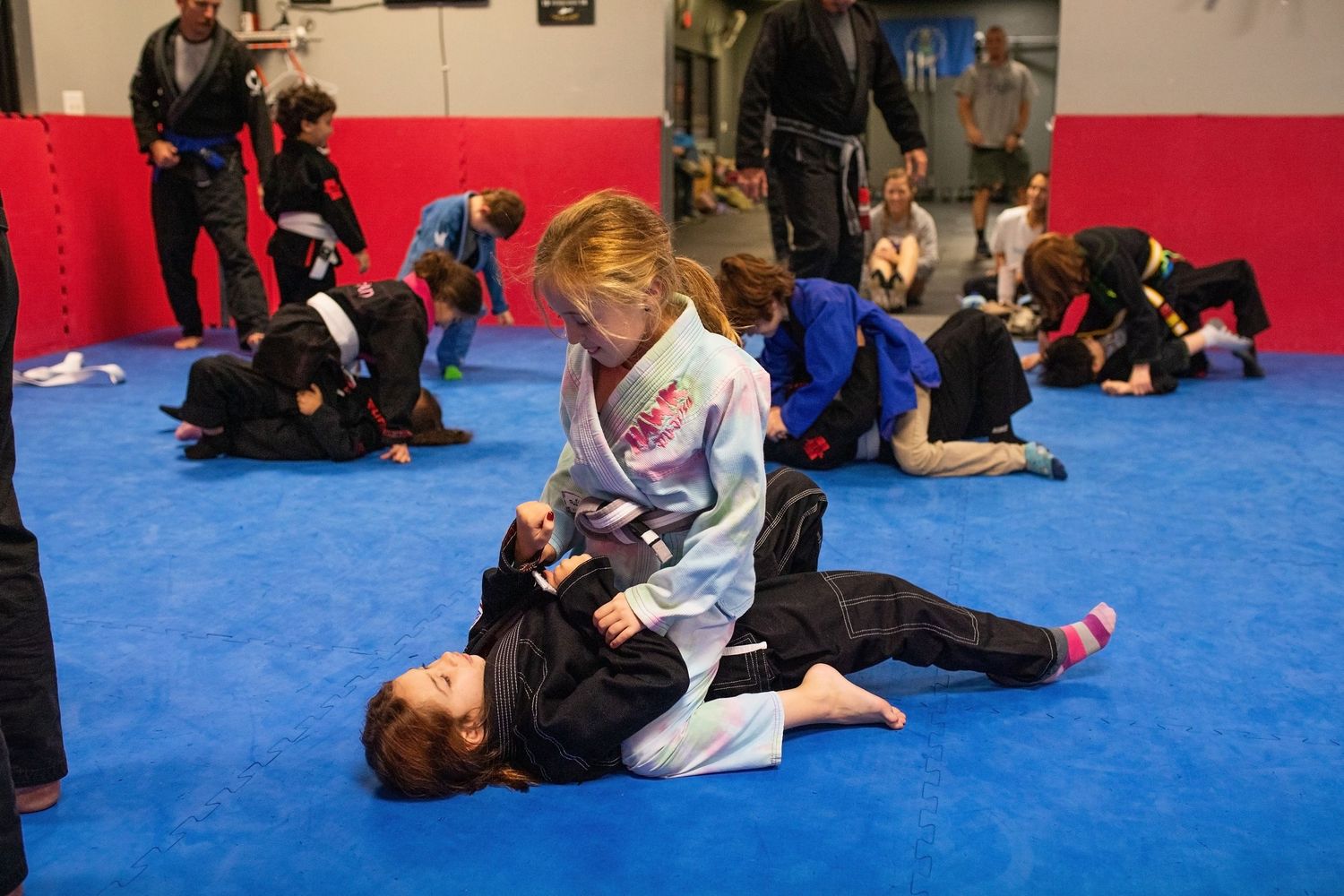 Kids Brazilian Jiu-Jitsu sparring during structured class