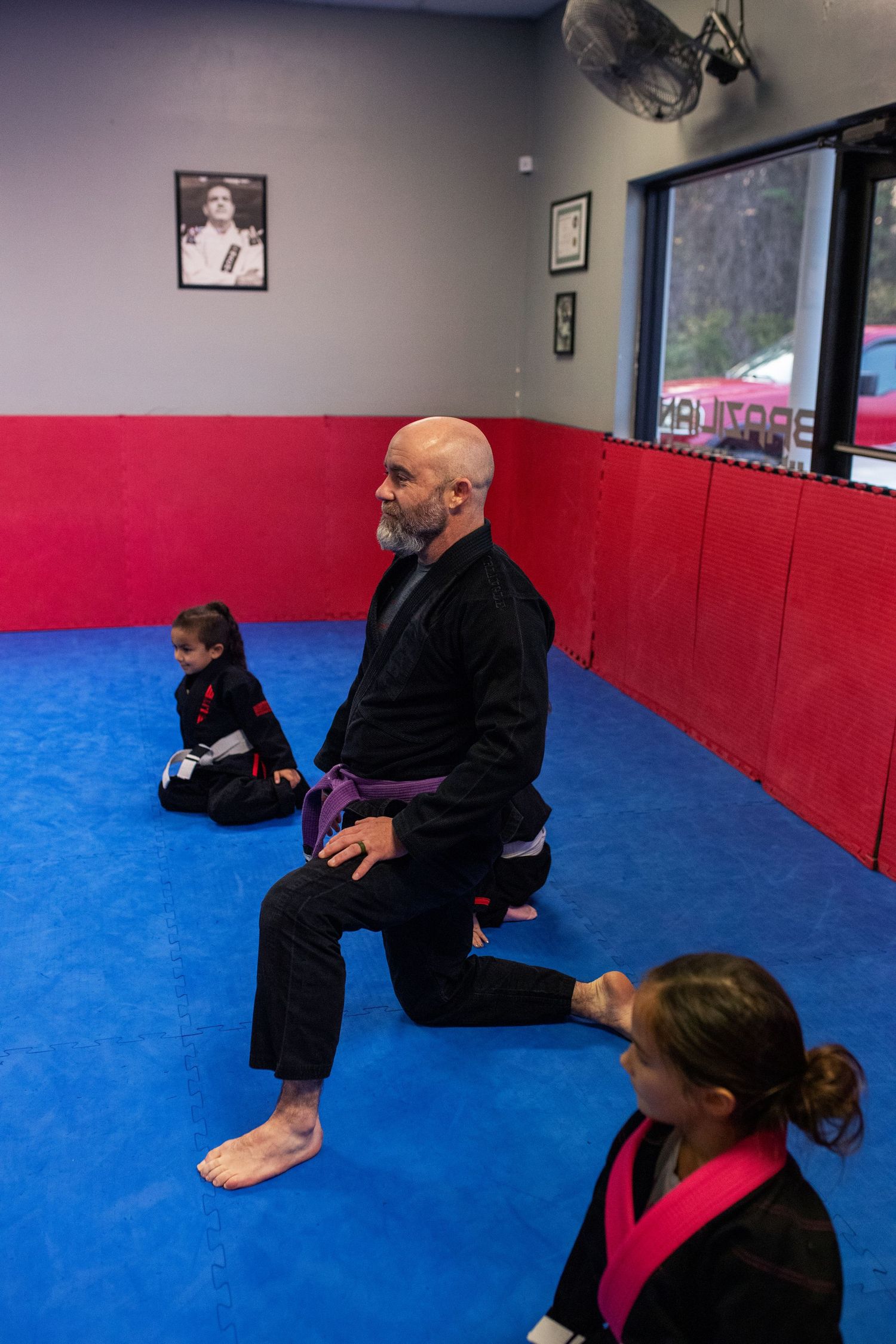 Martial arts instructor teaching kids focus and discipline
