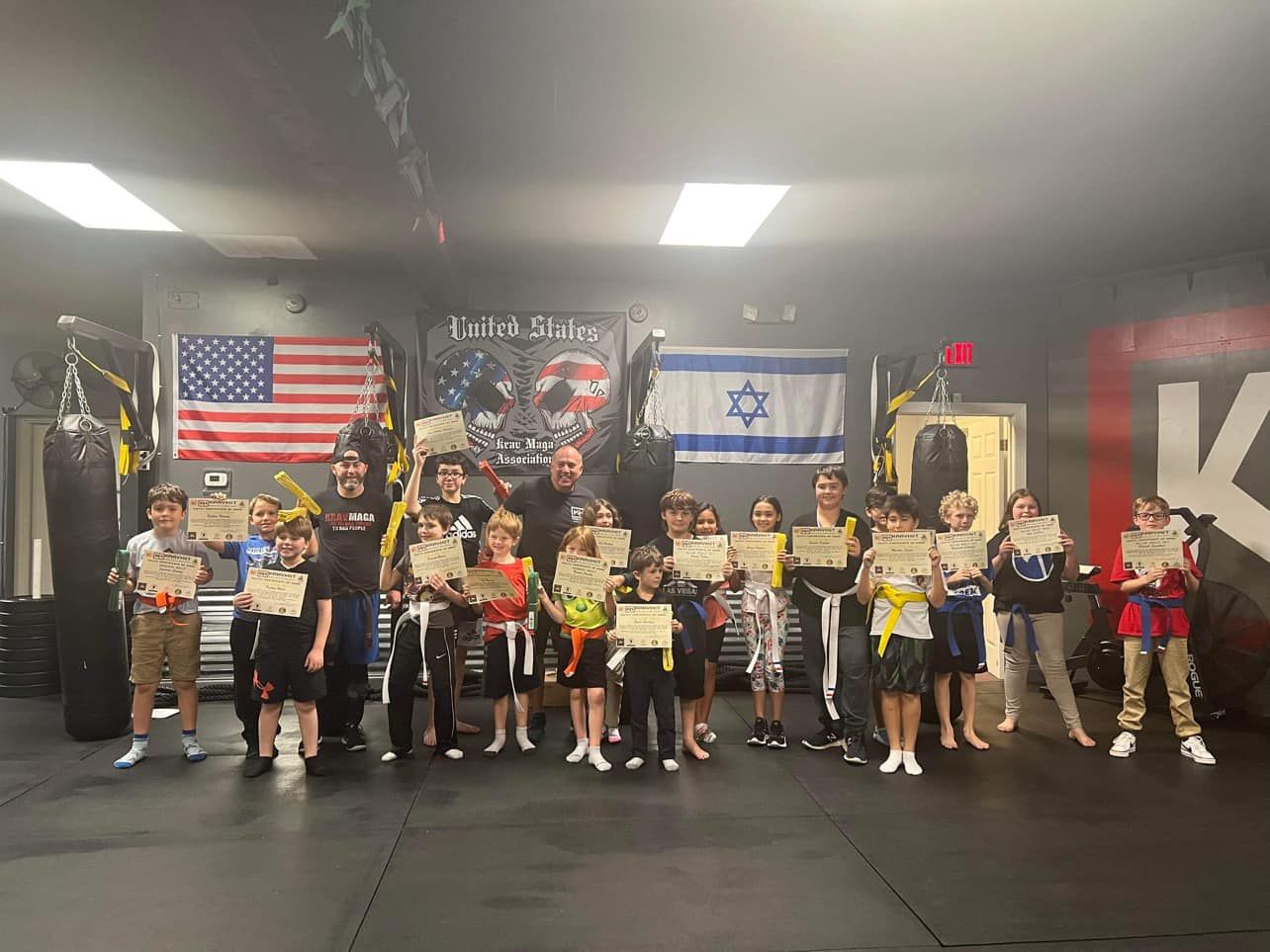 Martial arts students after class at family-friendly Krav Maga academy