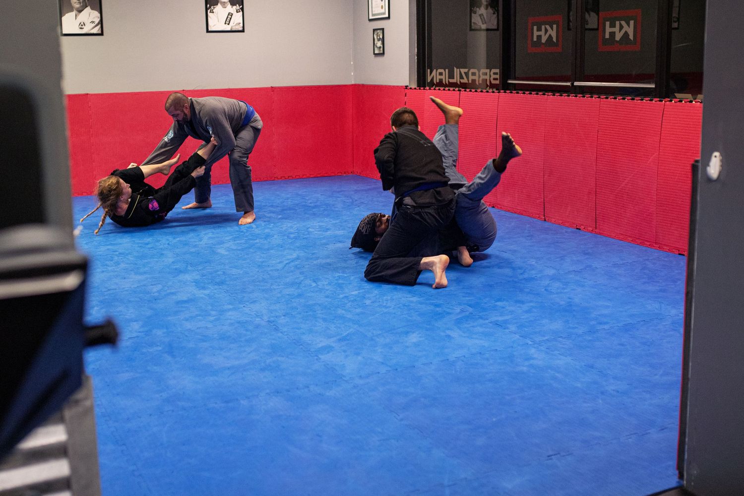 Adult Brazilian Jiu-Jitsu class training at martial arts academy in Rincon, Georgia