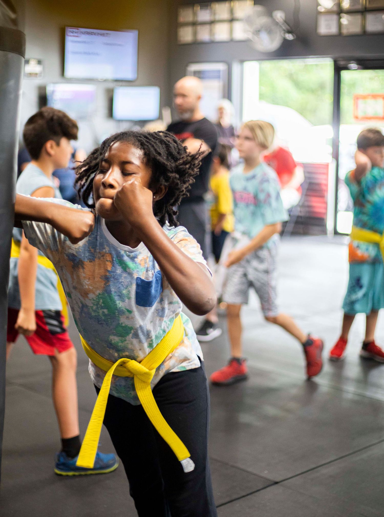 Children practicing safe self-defense drills