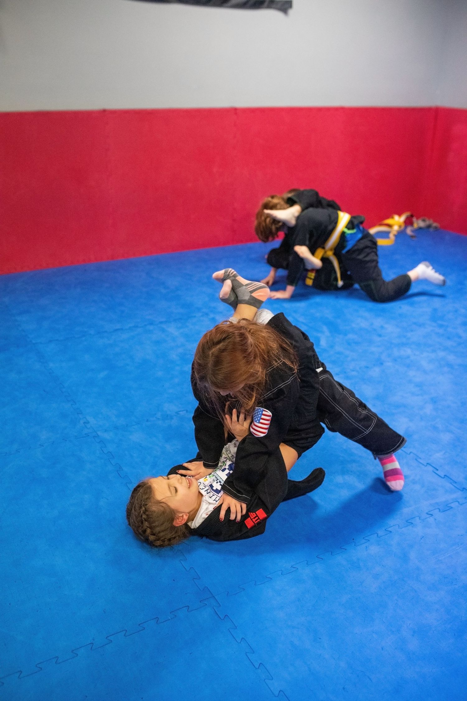 Kids Brazilian Jiu-Jitsu sparring during structured class