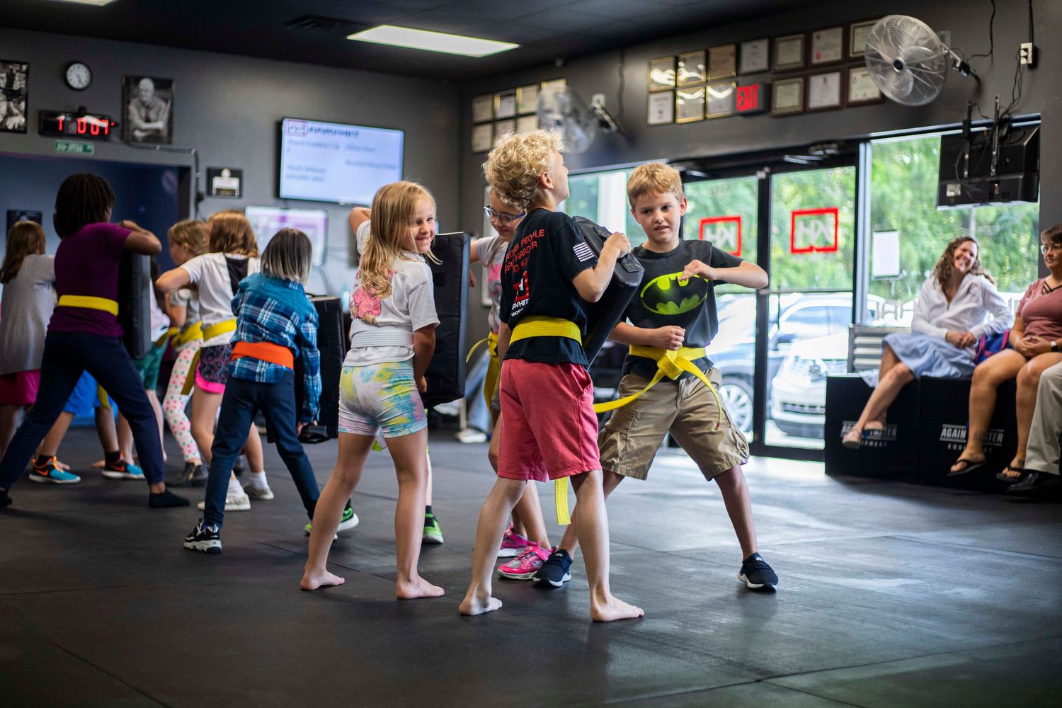 Children practicing self-defense techniques at KravHIIT academy