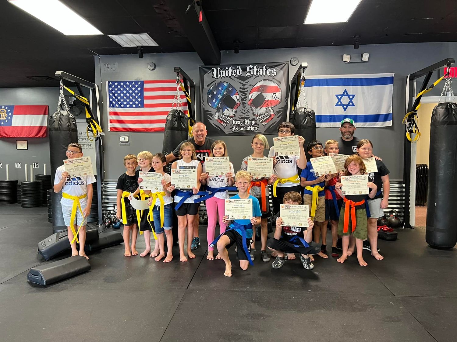Martial arts students after class at family-friendly Krav Maga academy