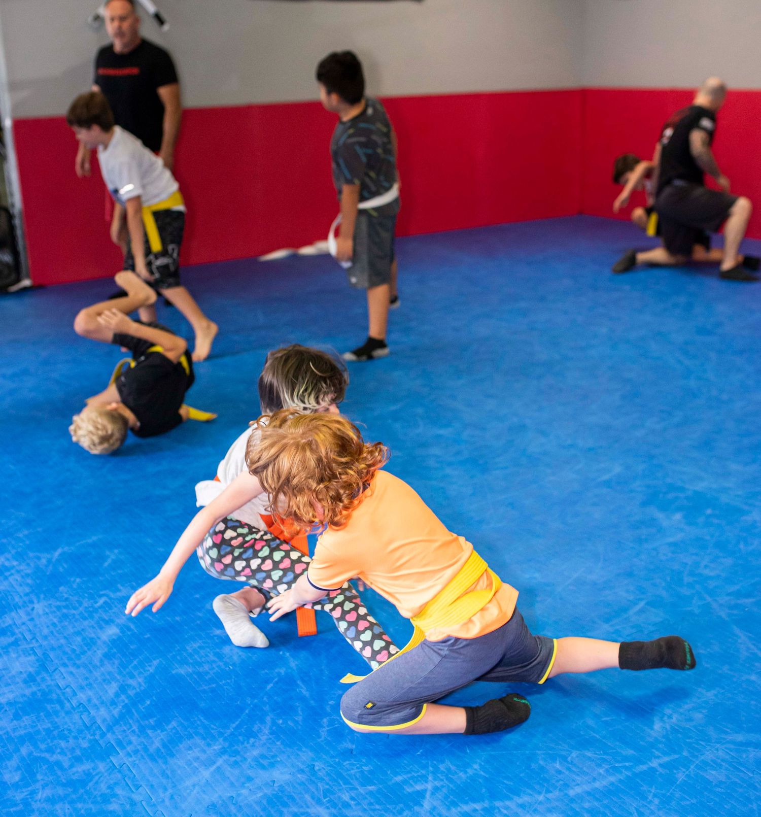 Kids Brazilian Jiu-Jitsu sparring during structured class