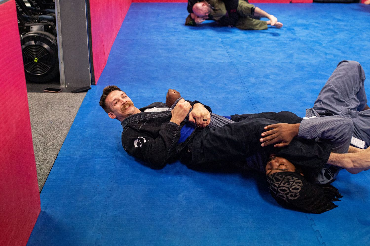 Adult Brazilian Jiu-Jitsu class training at martial arts academy in Rincon, Georgia