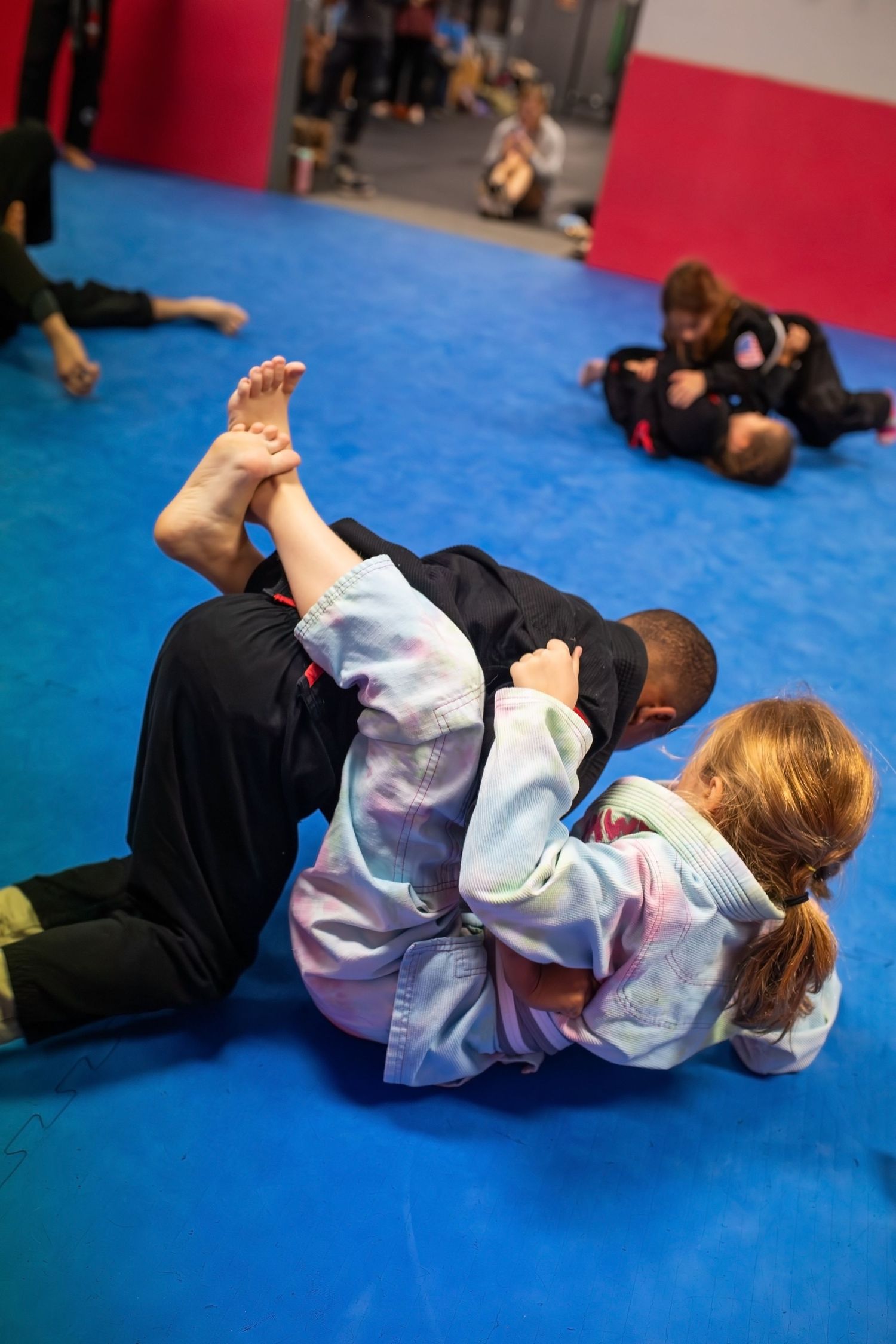Kids Brazilian Jiu-Jitsu sparring during structured class