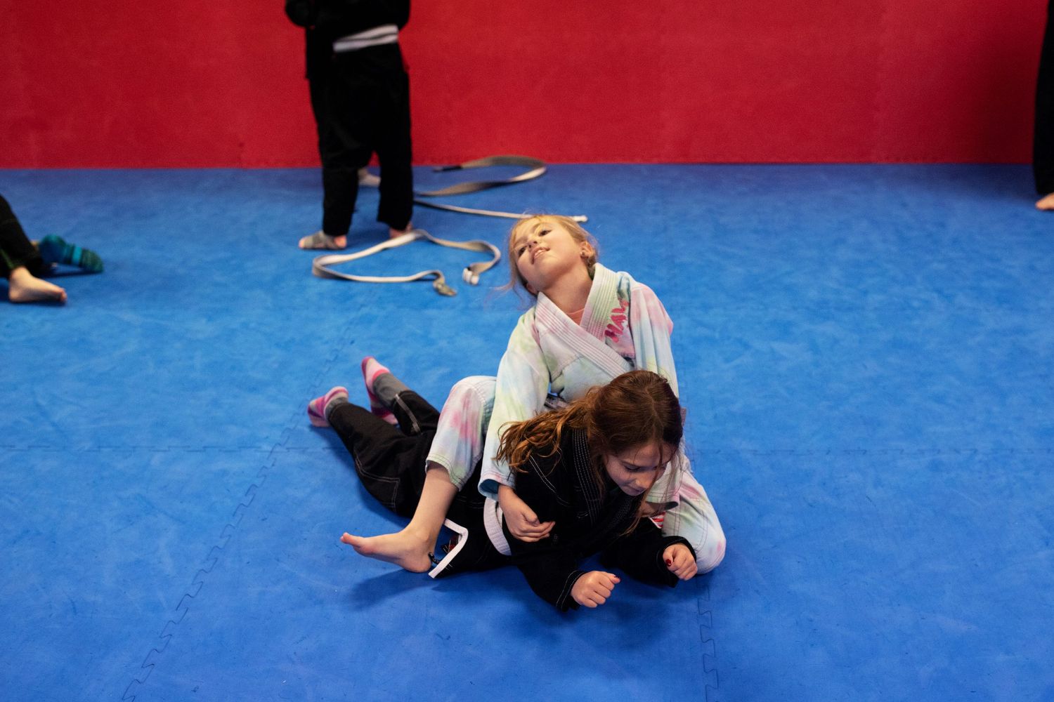 Kids Brazilian Jiu-Jitsu sparring during structured class