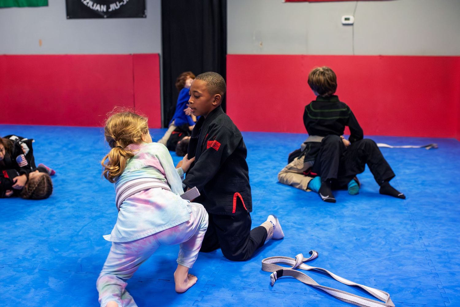 Kids Brazilian Jiu-Jitsu sparring during structured class