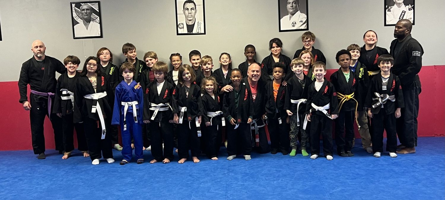 Martial arts students after class at family-friendly BJJ academy