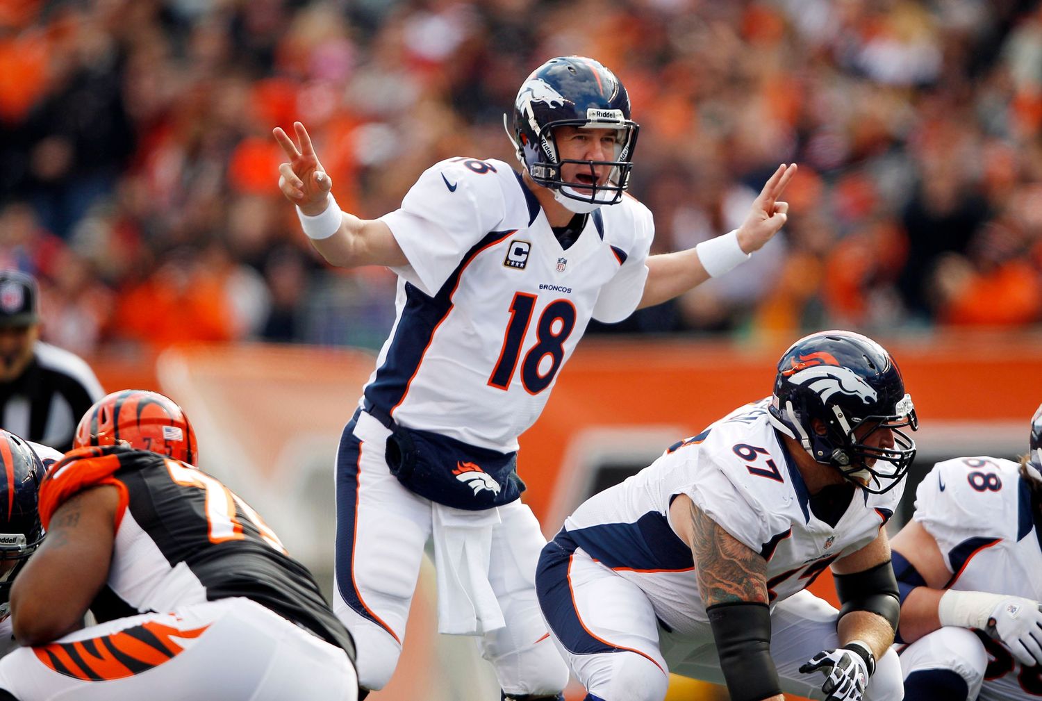 Denver Broncos quarterback throws a pass during an NFL football game against the Cincinnati Bengals.