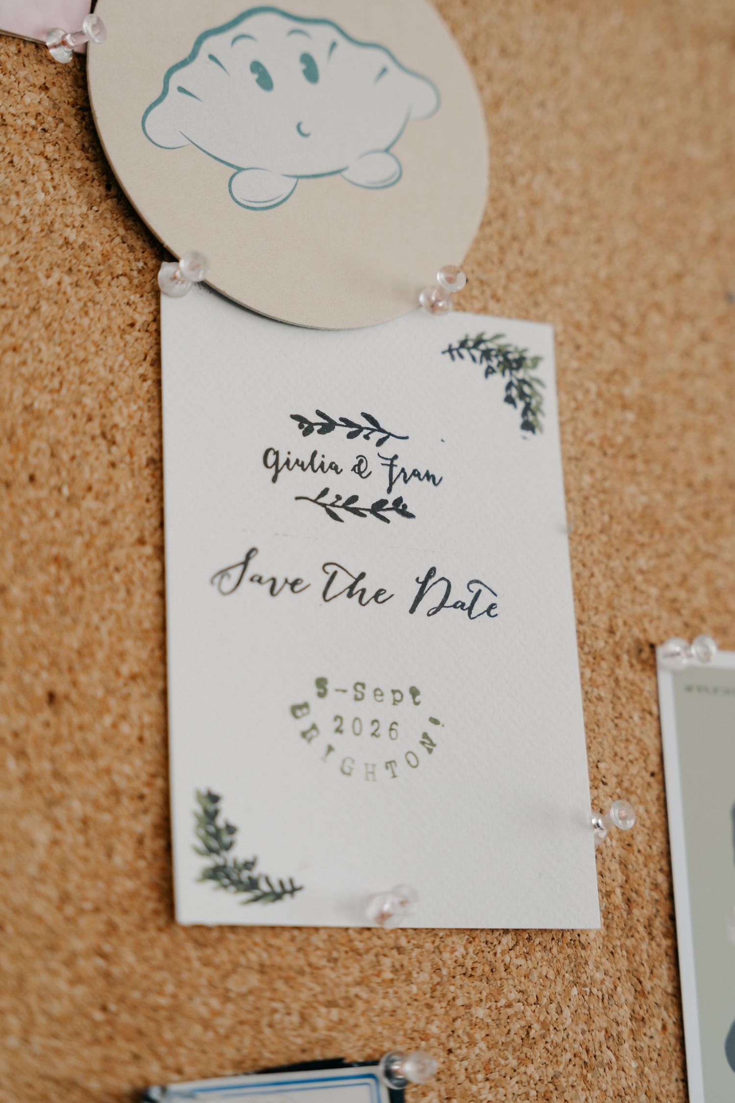 Elegant Save the Date card for Giulia and Fran, dated 5th September 2026 in Brighton, pinned on a corkboard.