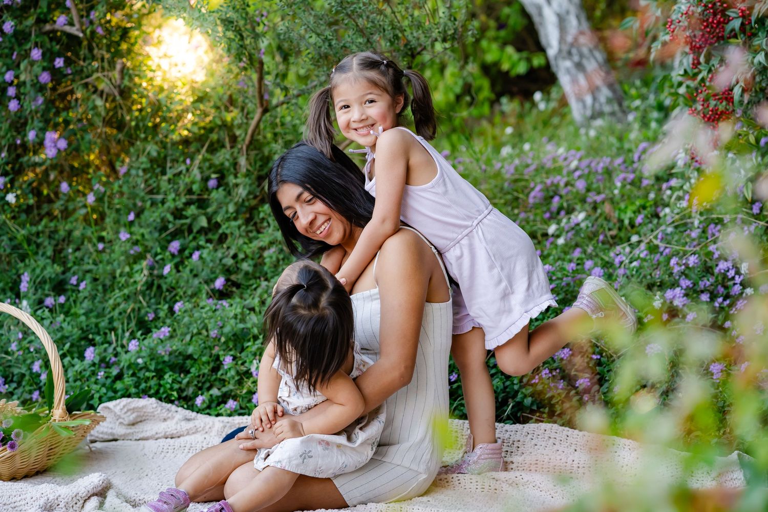 girls pops her foot while hugging mom for a mother's day photoshoot