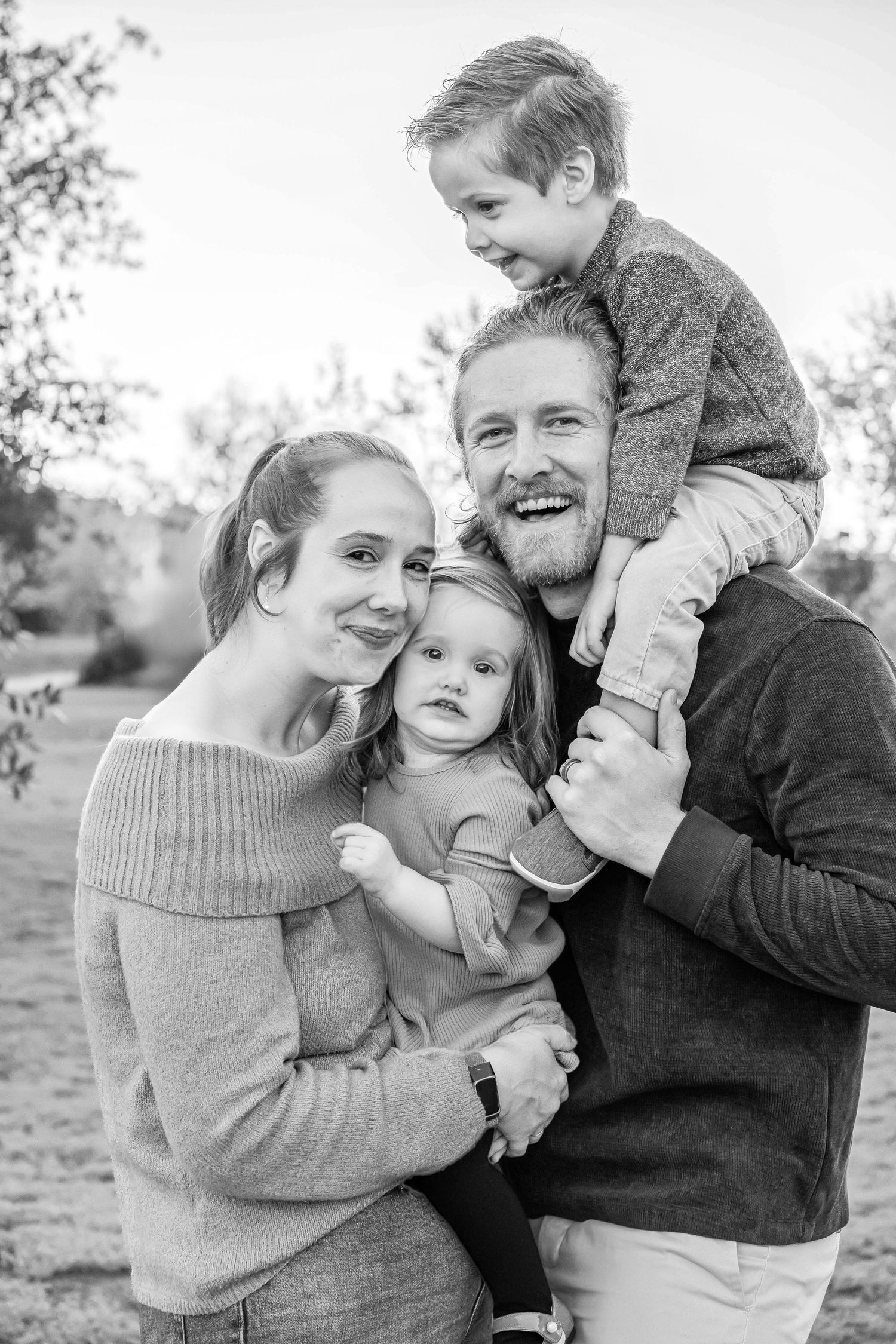 Turlock family photographer, Rachel Chamberlain, taking lifestyle family portraits at sunset with young kids/babies.