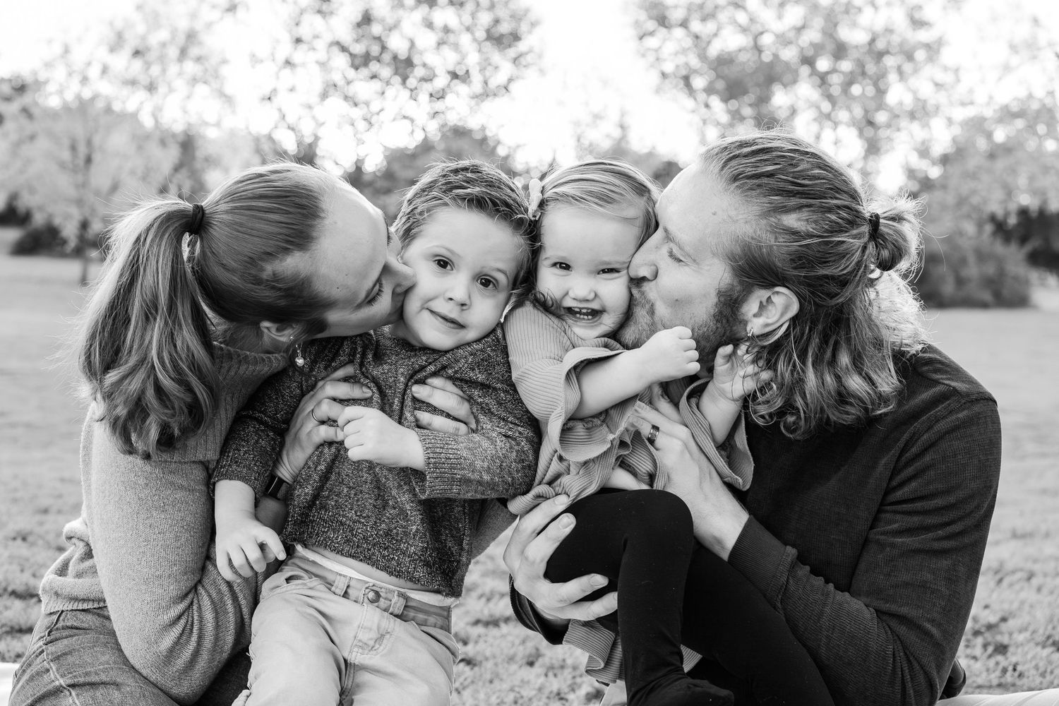 Turlock family photographer, Rachel Chamberlain, taking lifestyle family portraits at sunset with young kids/babies.