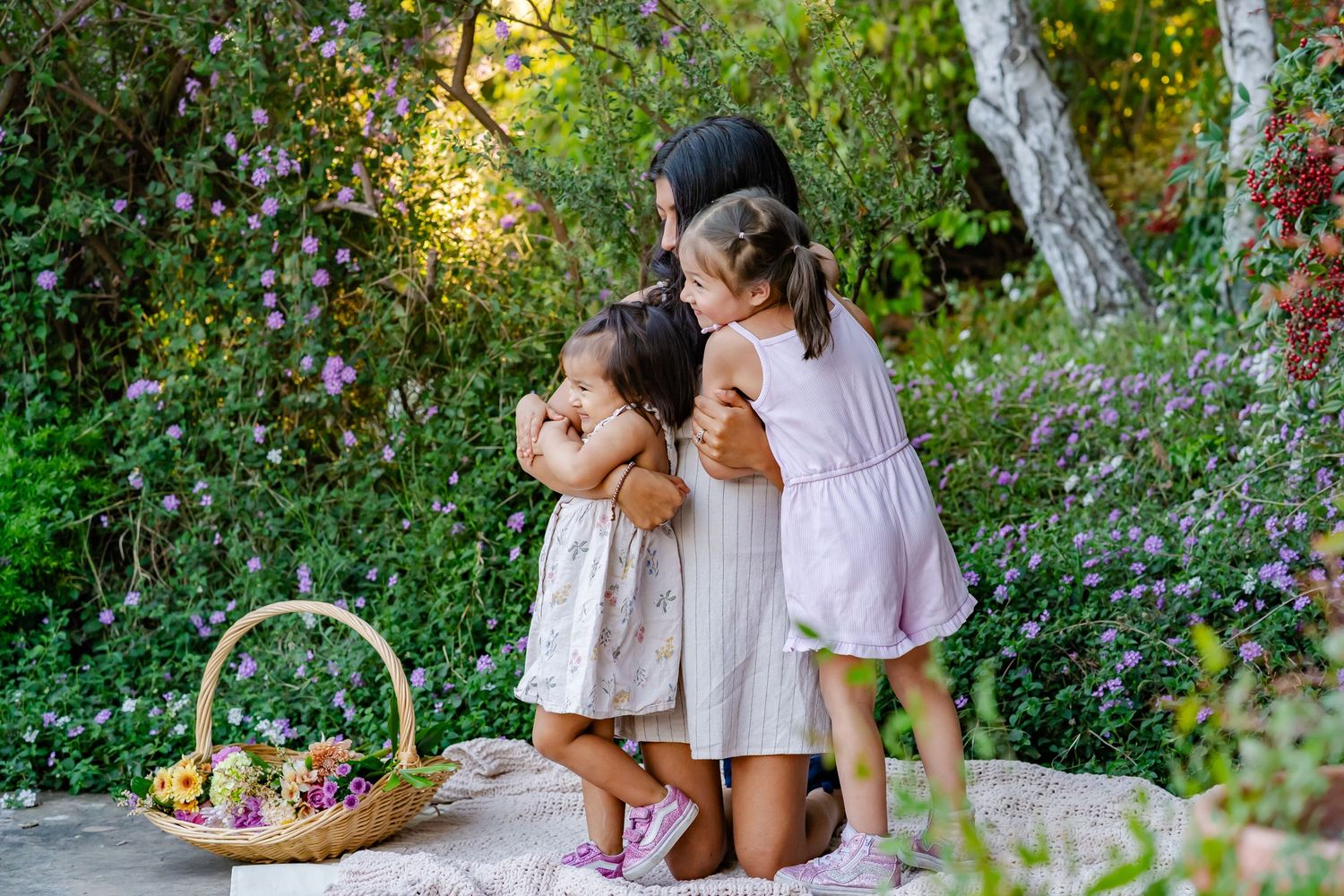 Mom hugs her daughters in a Turlock, CA photo session
