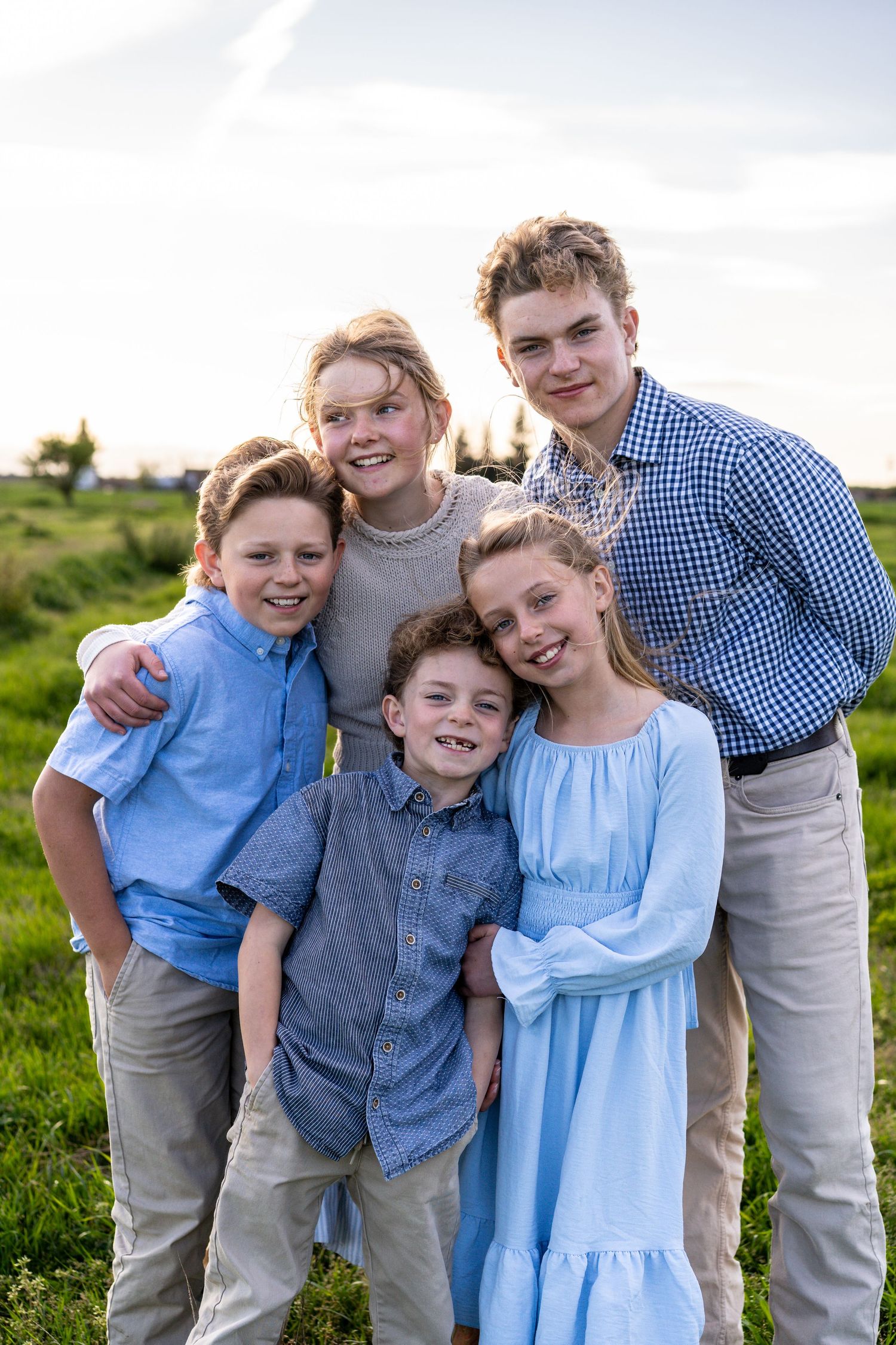 portrait of siblings hugging