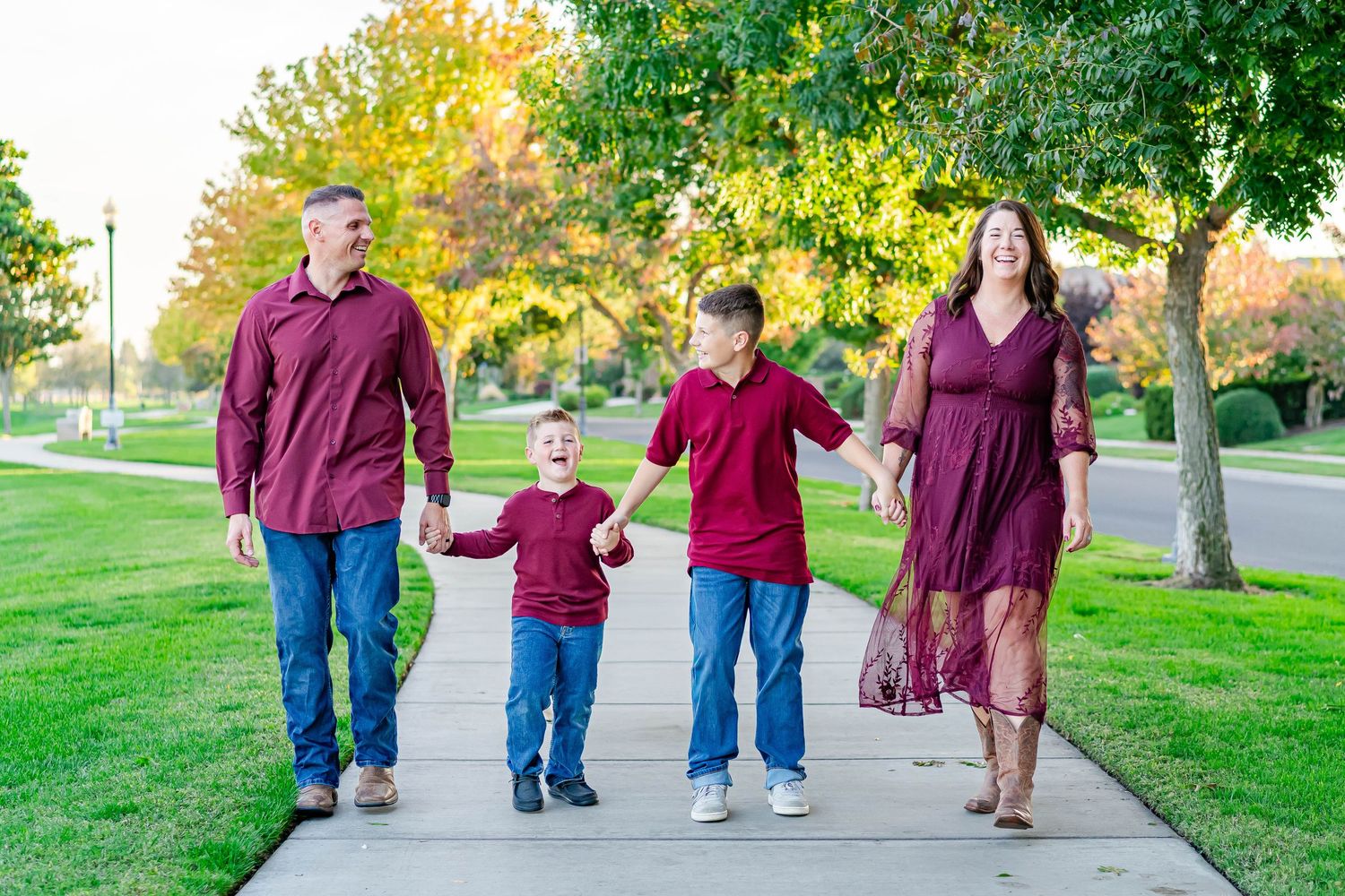 Turlock family photographer, Rachel Chamberlain, taking lifestyle family portraits at golden hour with kids running and playing.