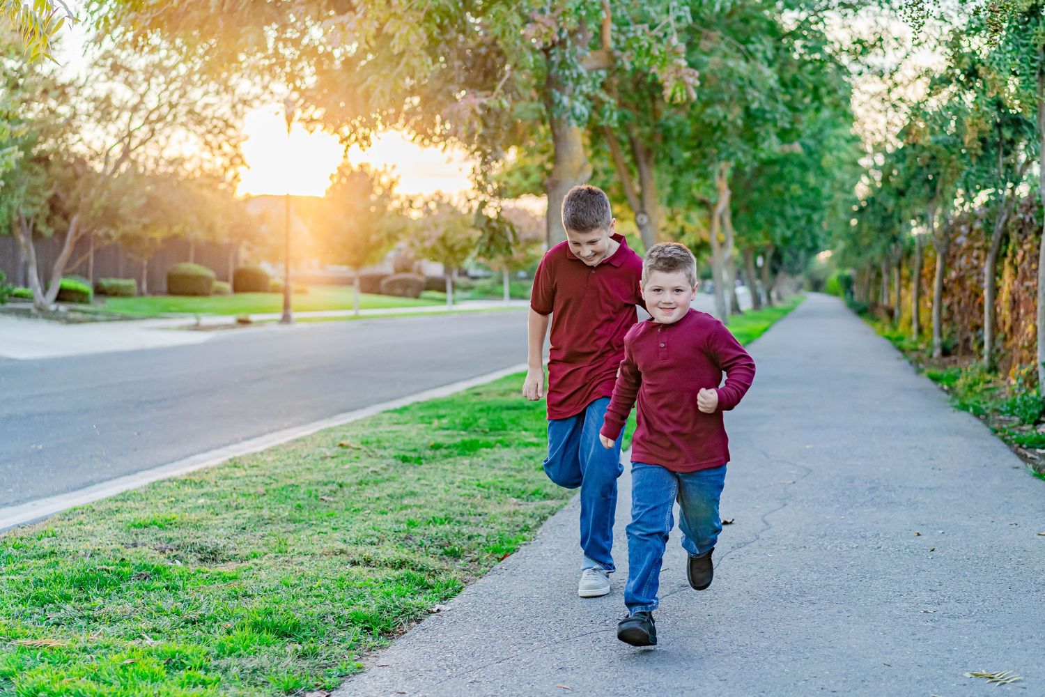 Turlock family photographer, Rachel Chamberlain, taking lifestyle family portraits at golden hour with kids running and playing.