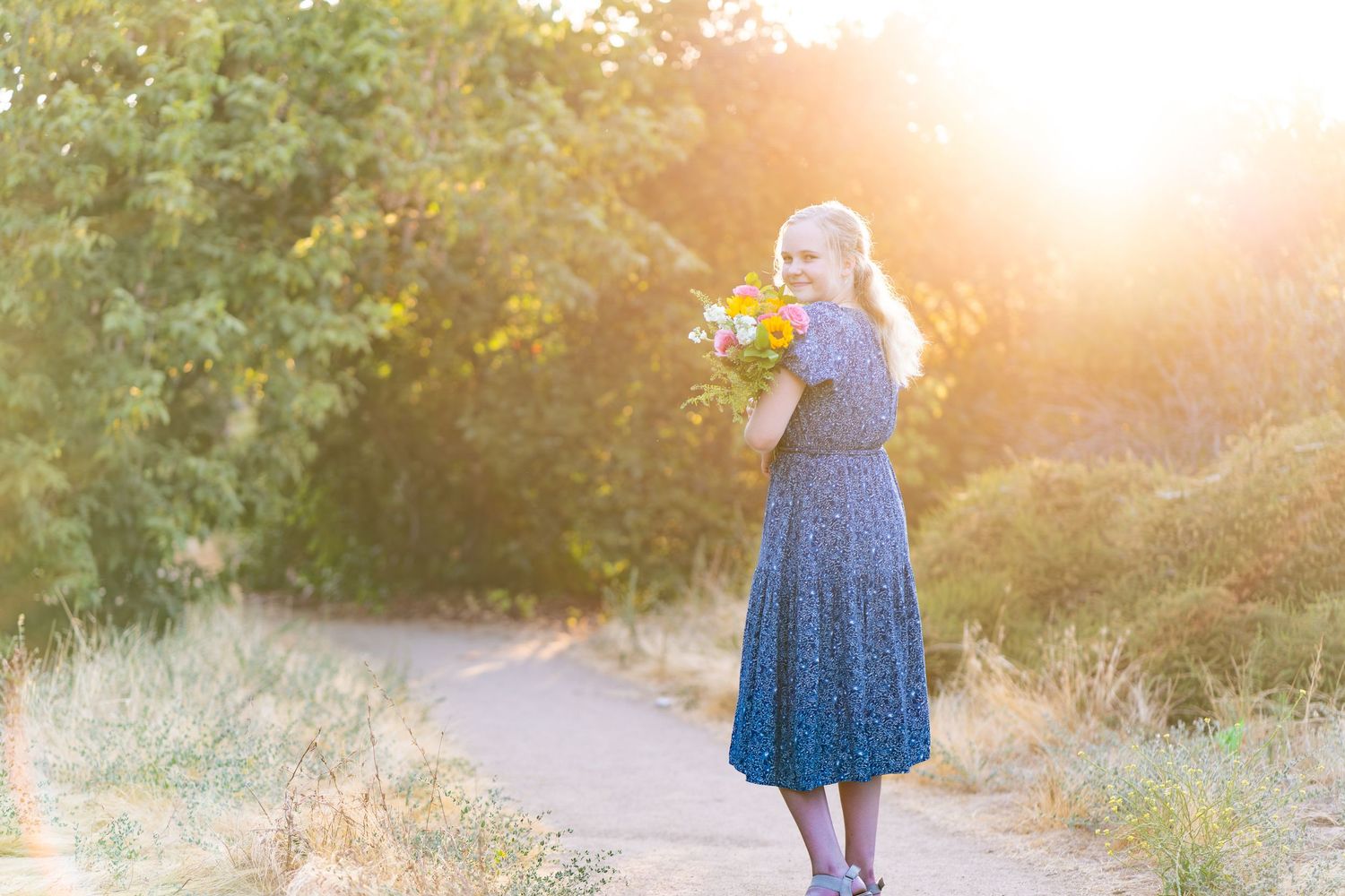 Portrait of girl holding flowers