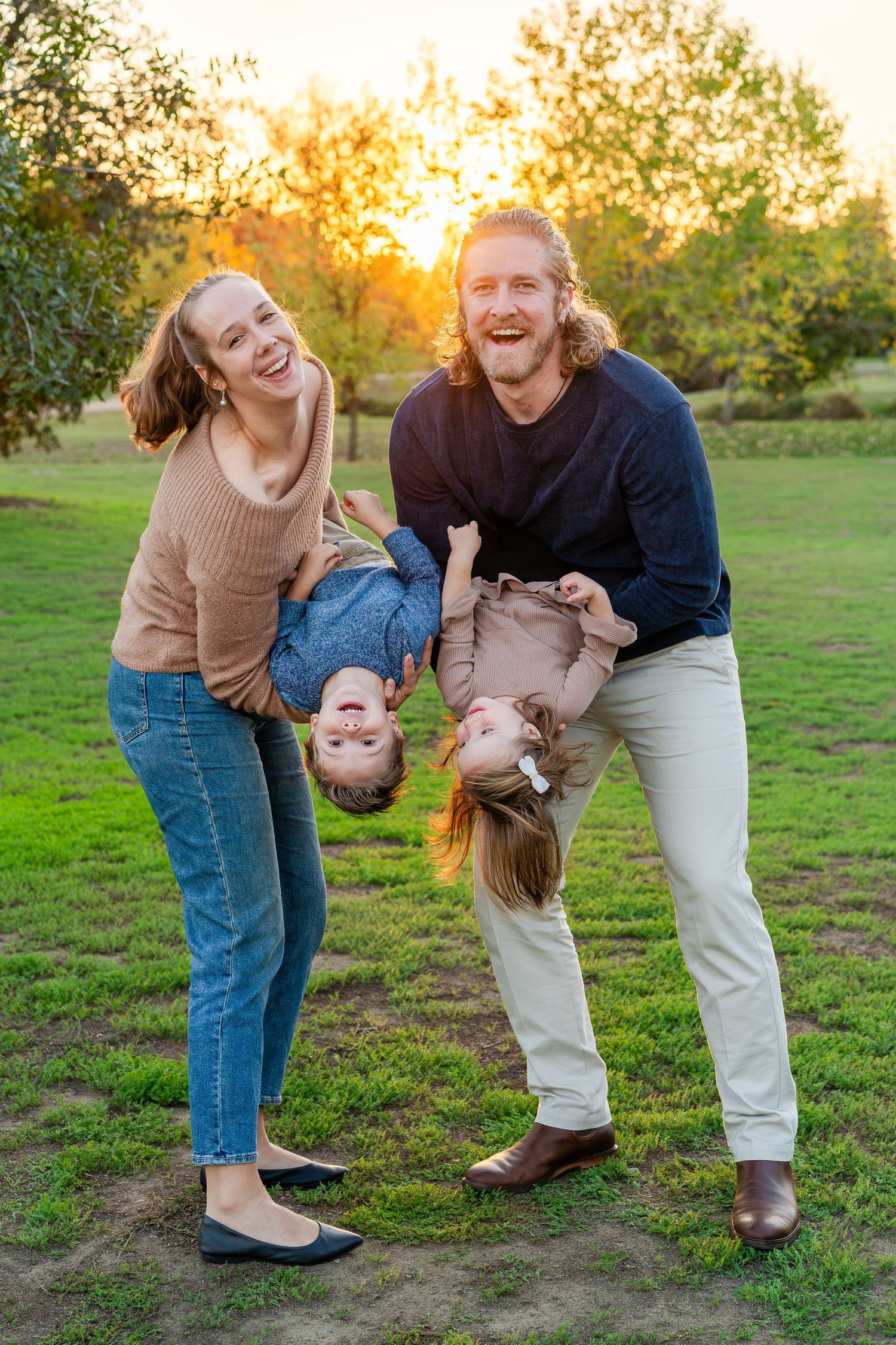 Turlock family photographer, Rachel Chamberlain, taking lifestyle family portraits at sunset with young kids/babies.