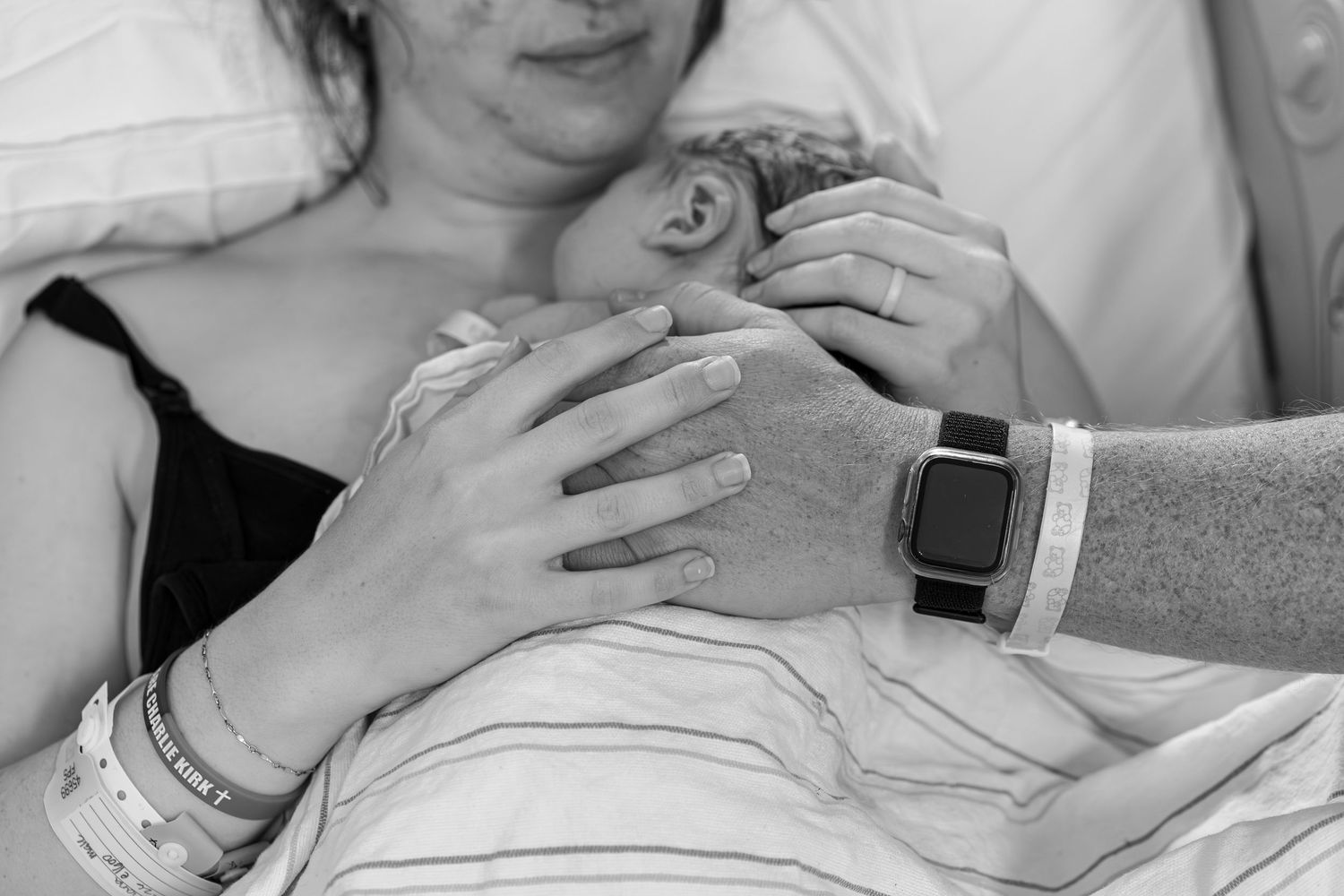 Parents admiring their newborn baby within the first 48 hours after birth in Turlock.