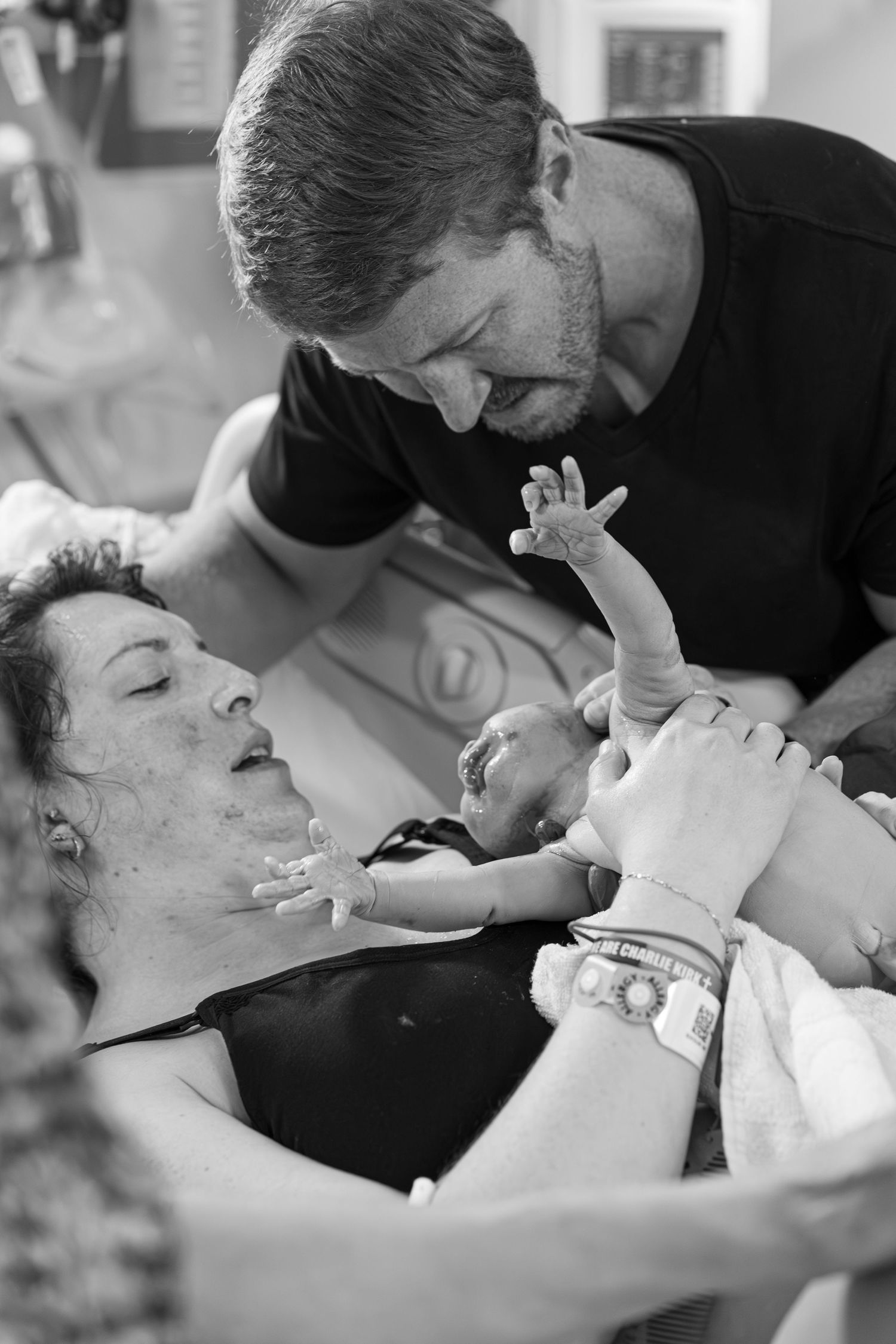 New parents meeting their baby for the first time during a hospital birth in California's Central Valley.