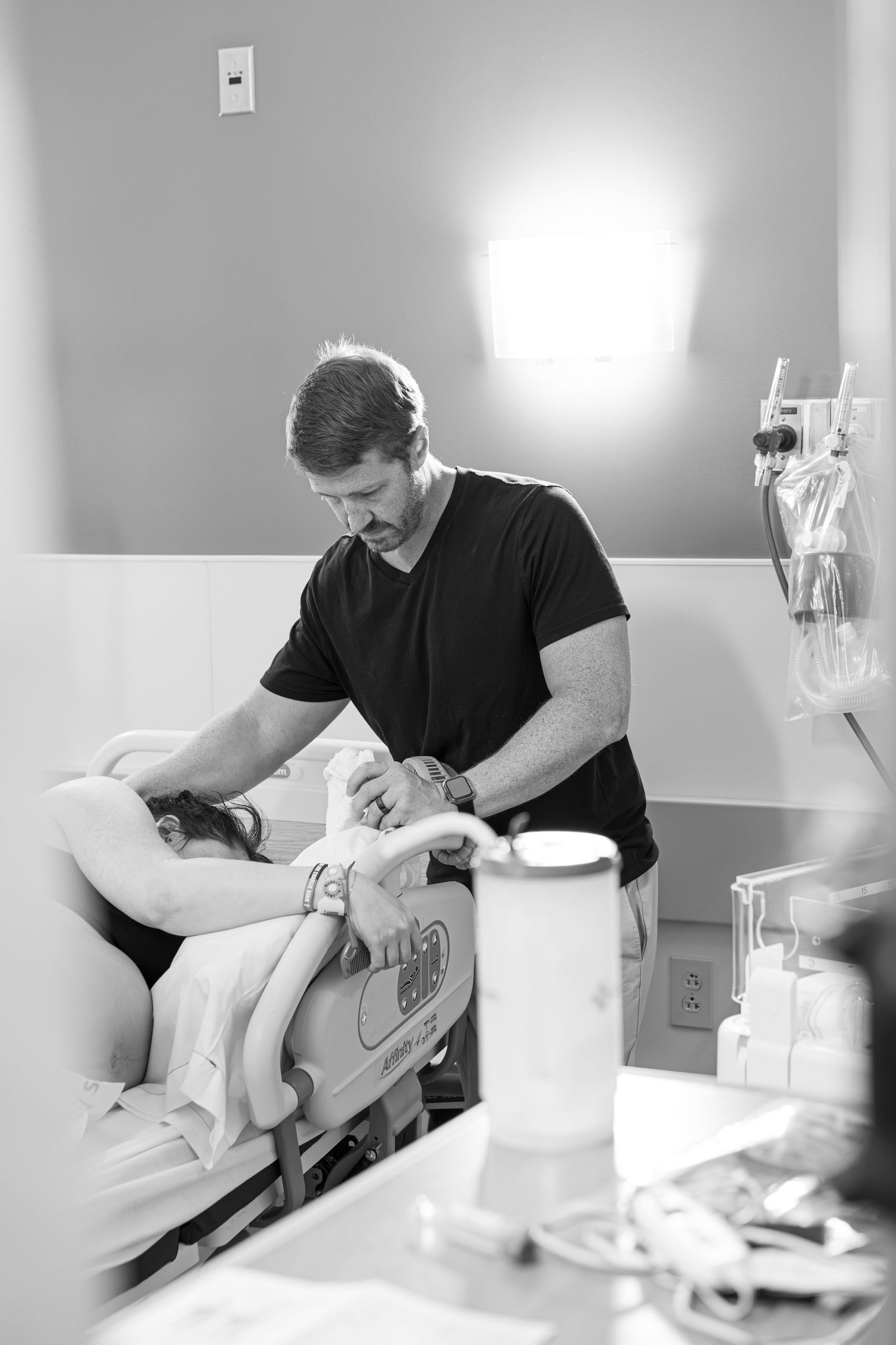 Husband helping wife through contractions