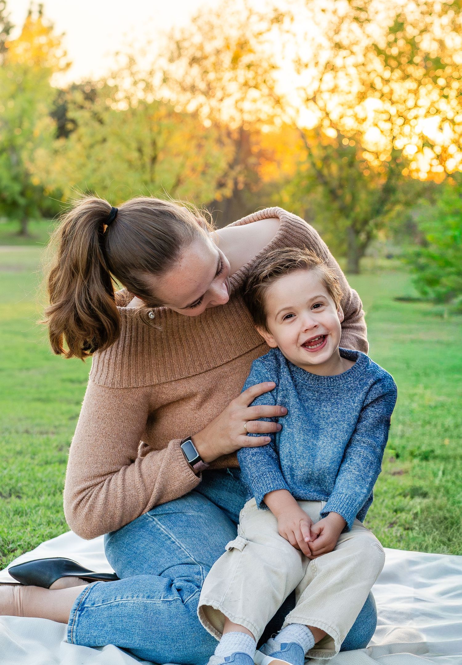 Turlock family photographer, Rachel Chamberlain, taking lifestyle family portraits at sunset with young kids/babies.