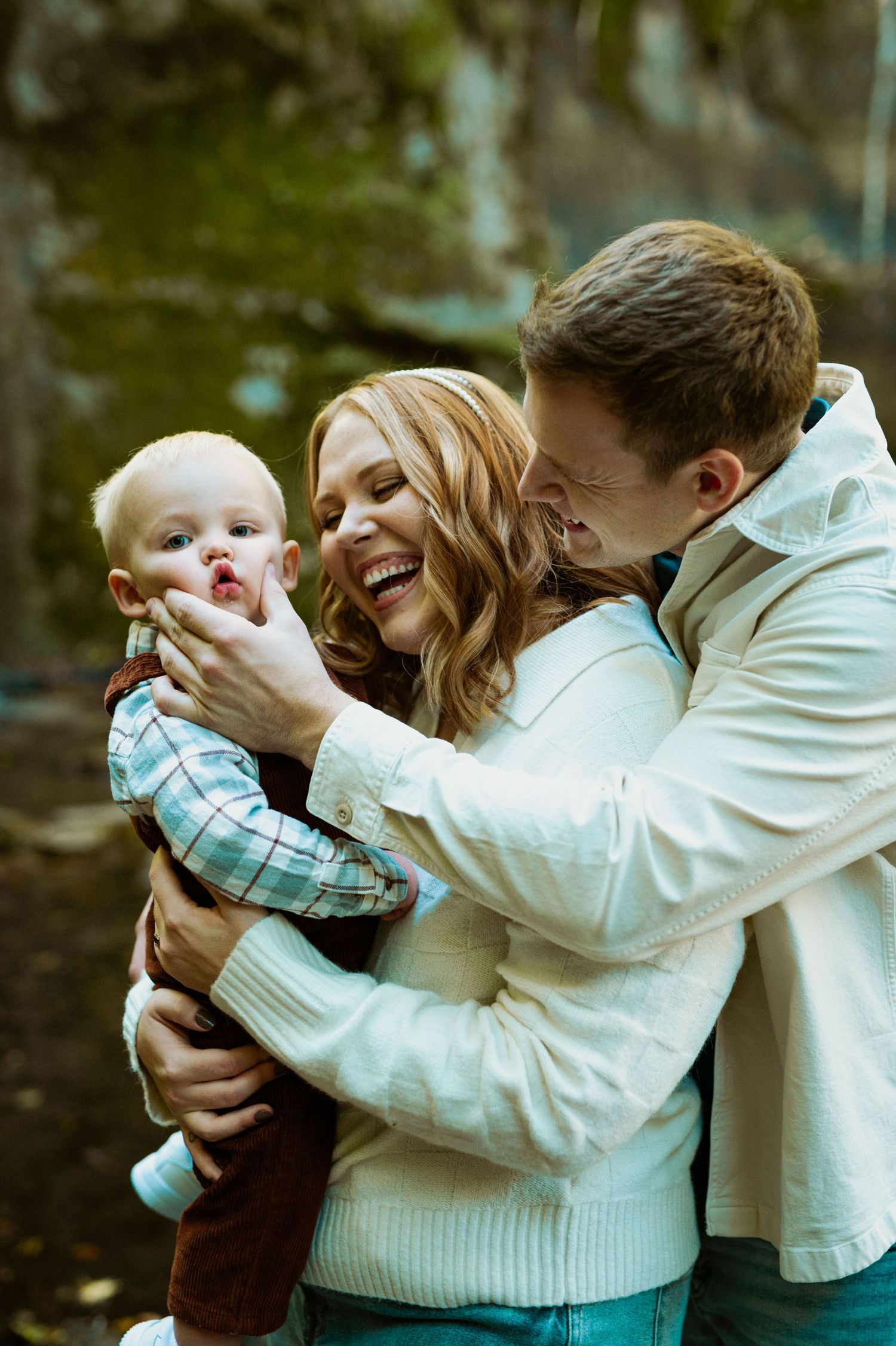 Joyful family moment captured outdoors with everyone laughing together.