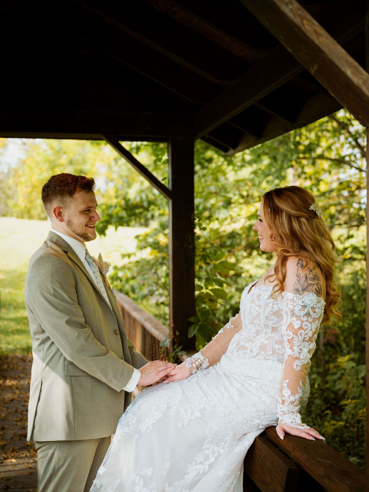 Romantic dance moment under covered outdoor area.