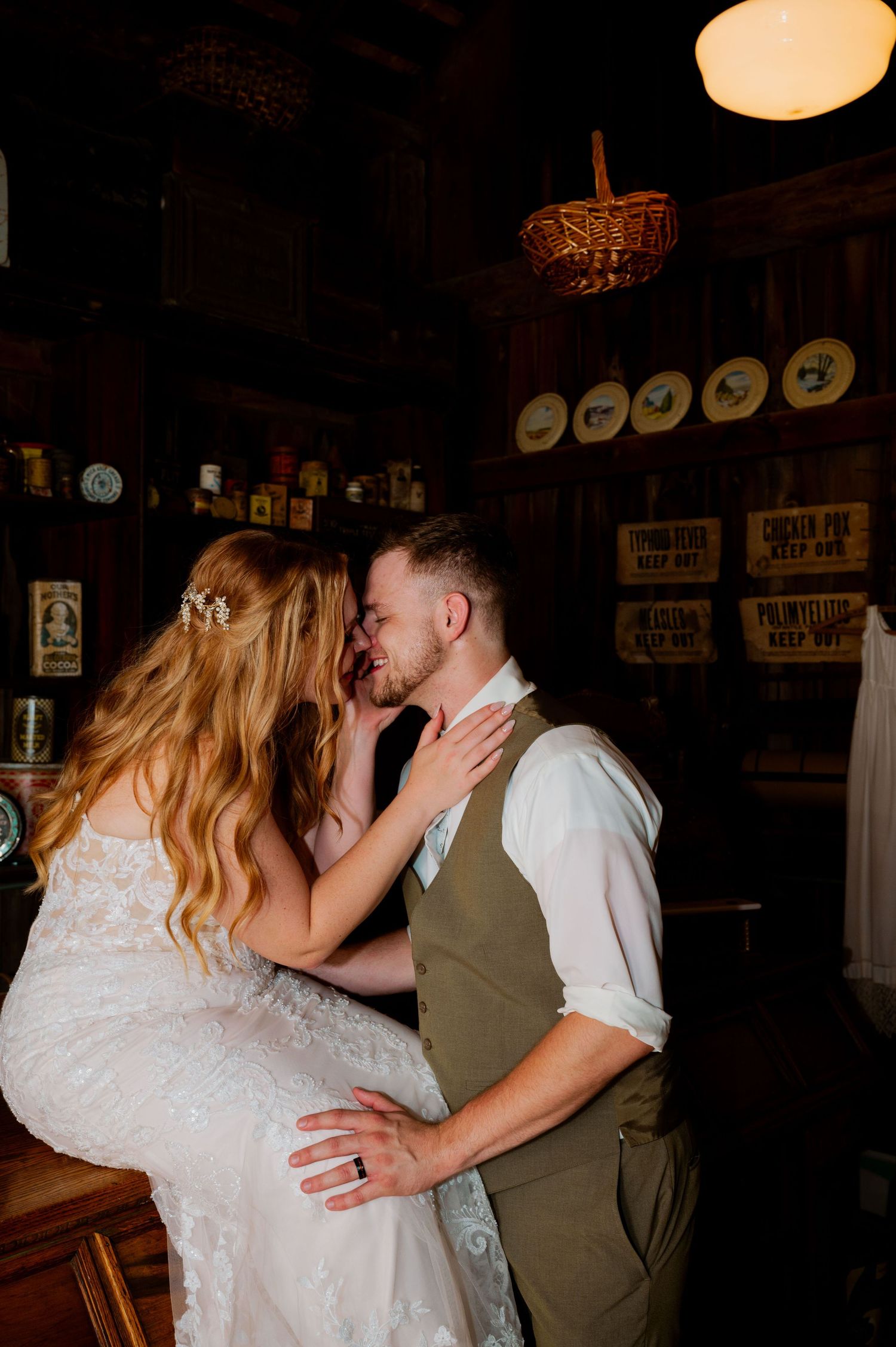Intimate wedding dance moment captured in a rustic venue with vintage decor.