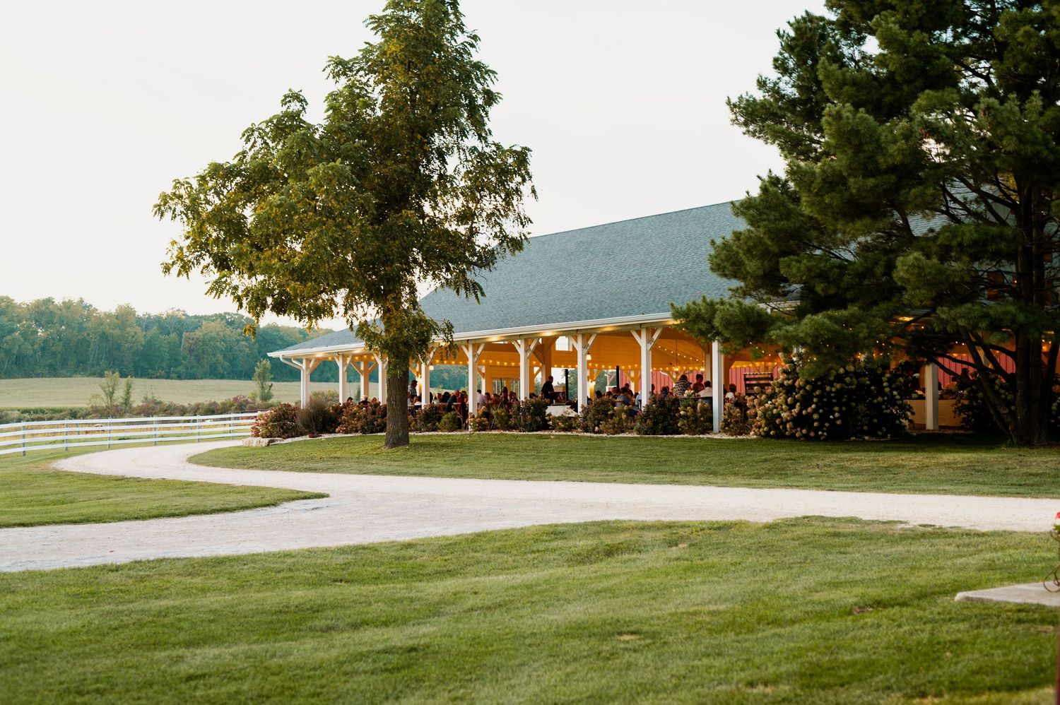 Scenic view of wedding venue grounds with rolling hills and manicured lawn.