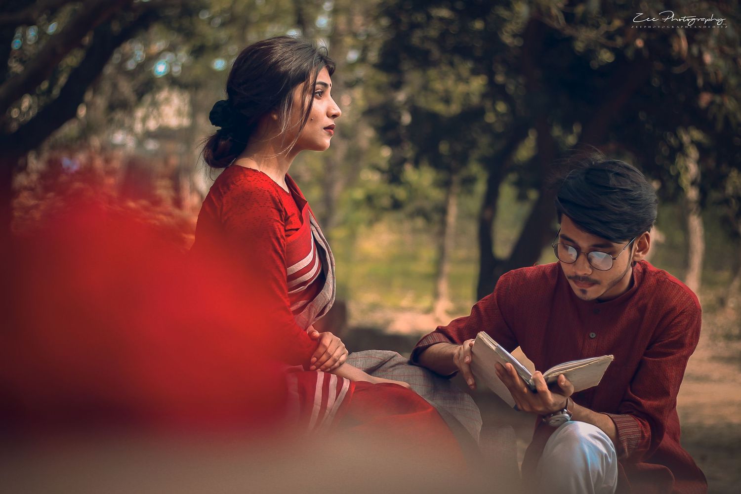 Golden hour photoshoot captures intimate moments between couple in nature.