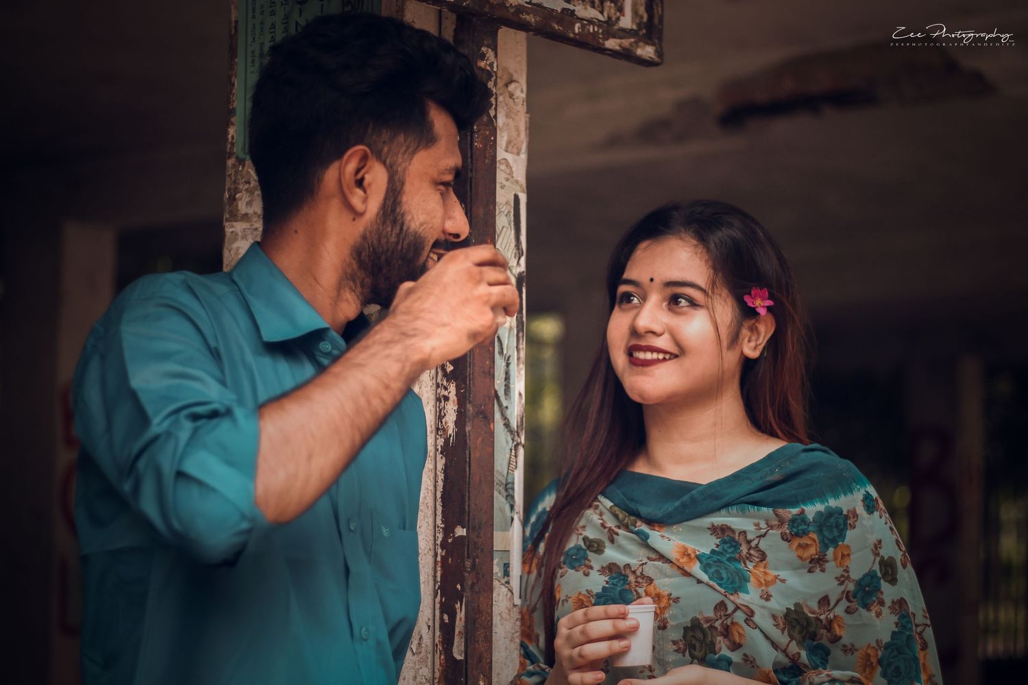 A couple in coordinating teal and floral outfits share playful moments in a romantic photoshoot sequence.