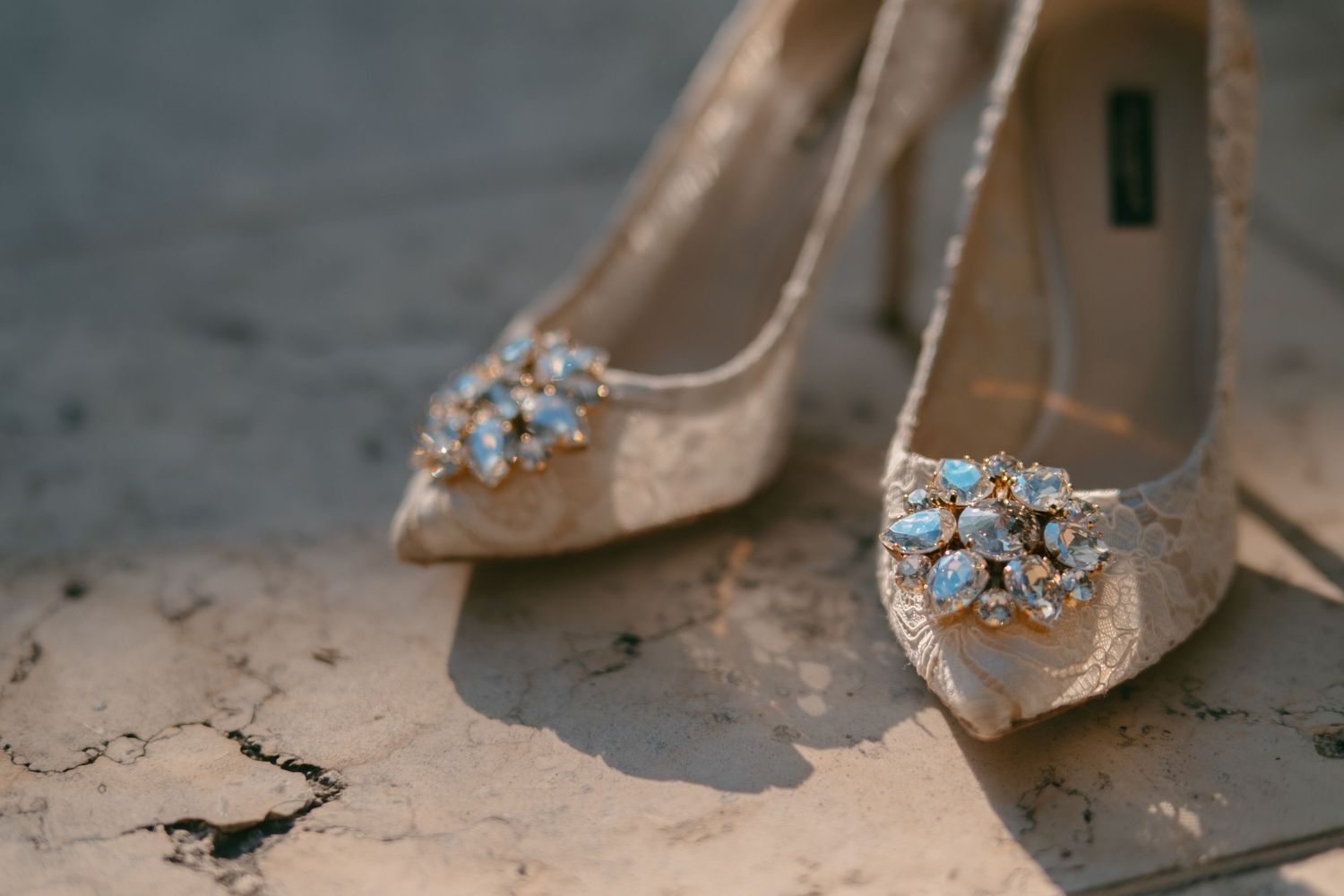 Elegant bridal shoes with crystal embellishments in nude color.