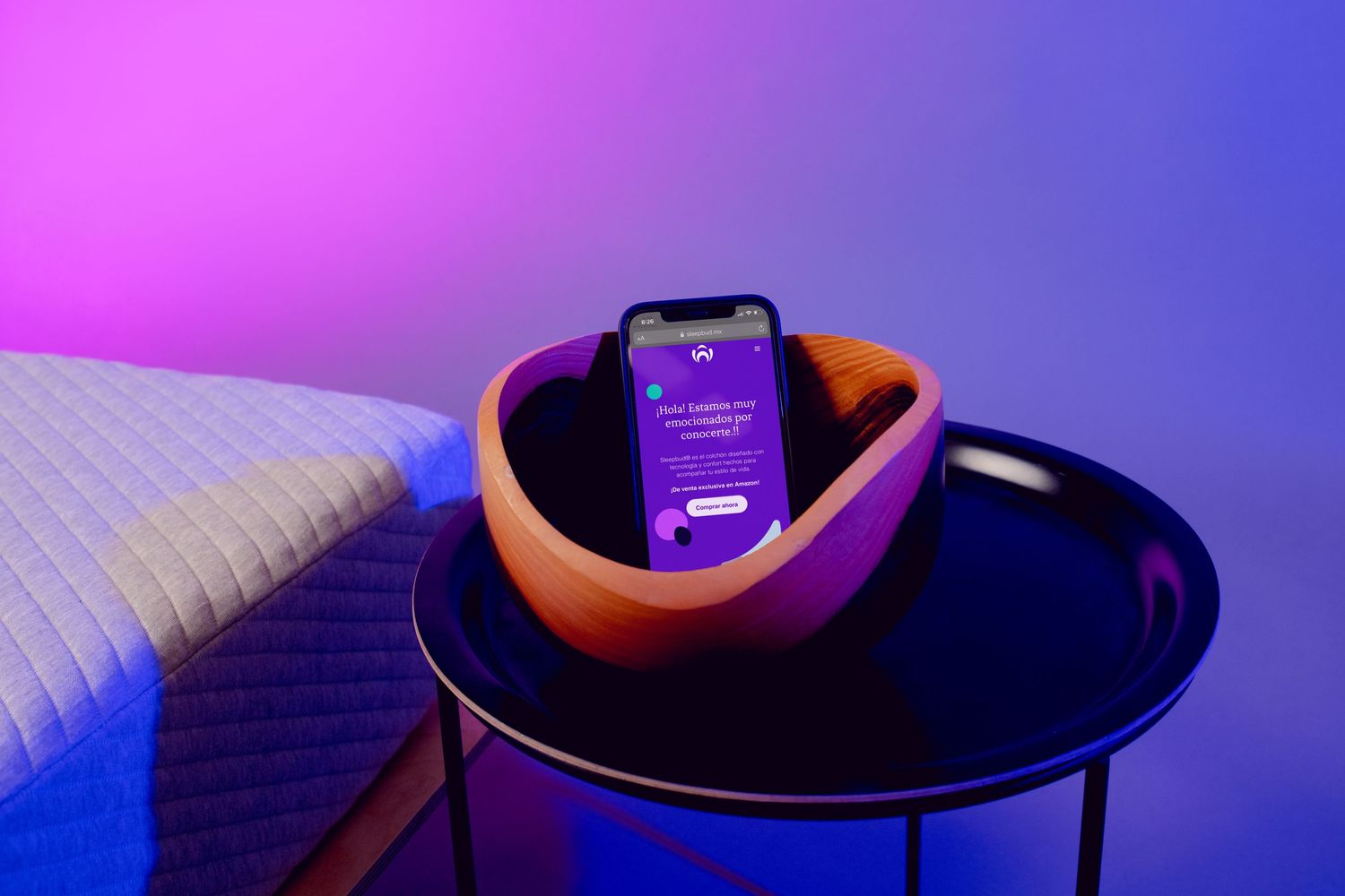 Purple and blue neon-lit circular side tables display smartphone against a black surface in a modern setting.