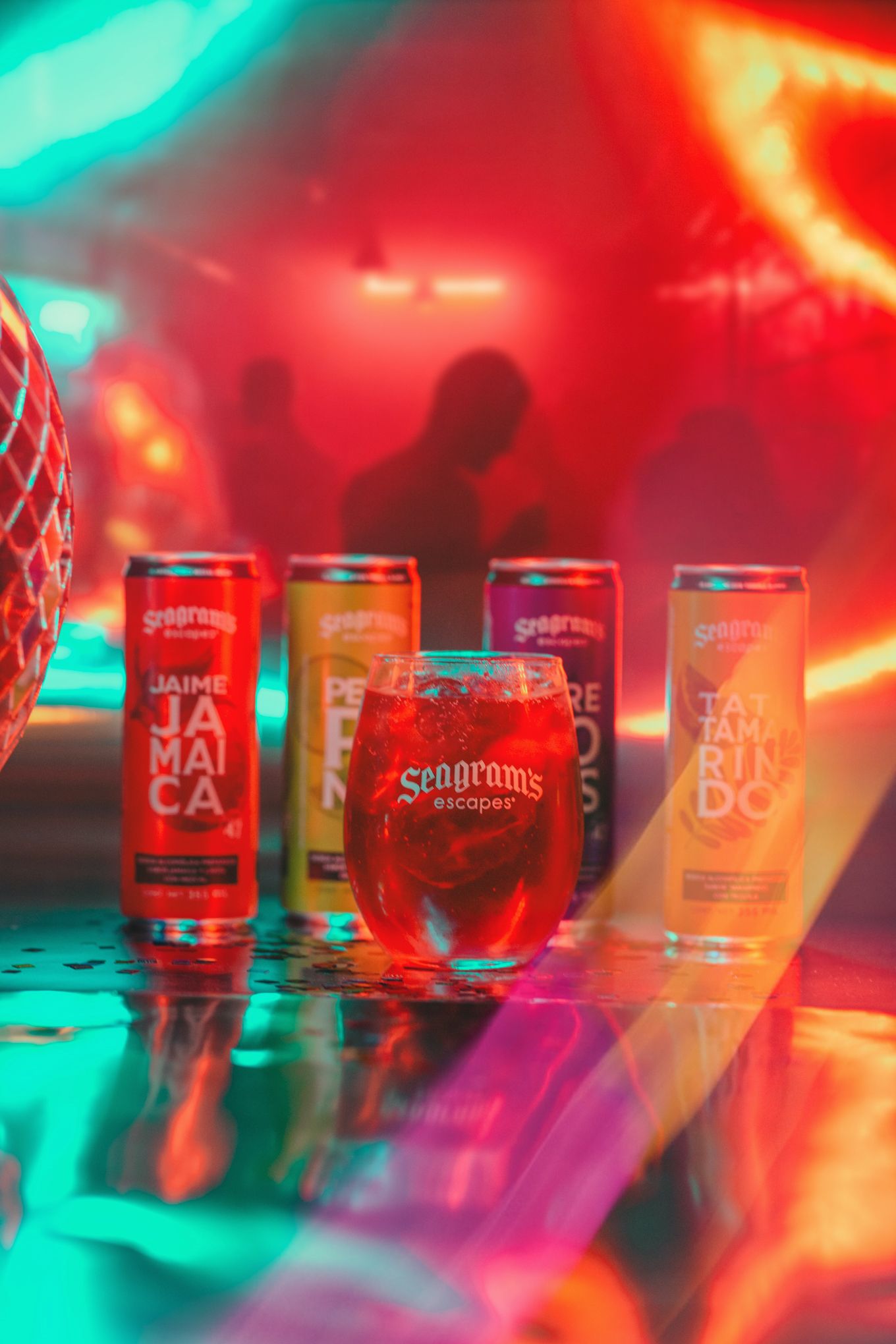 Colorful display of Seagrams canned cocktails with neon lighting and reflective surfaces.