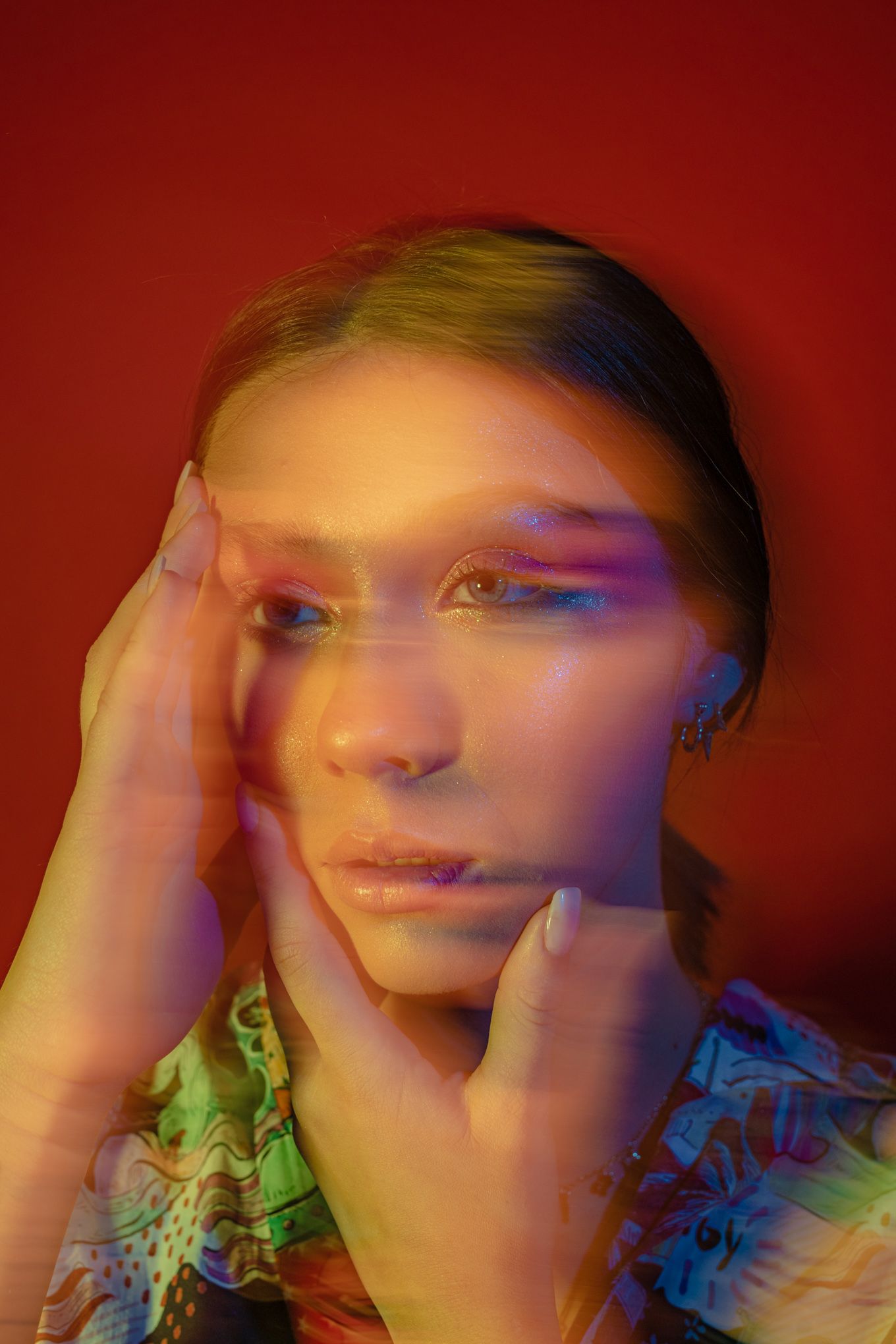 Double exposure portrait with colorful lighting and motion blur effects.