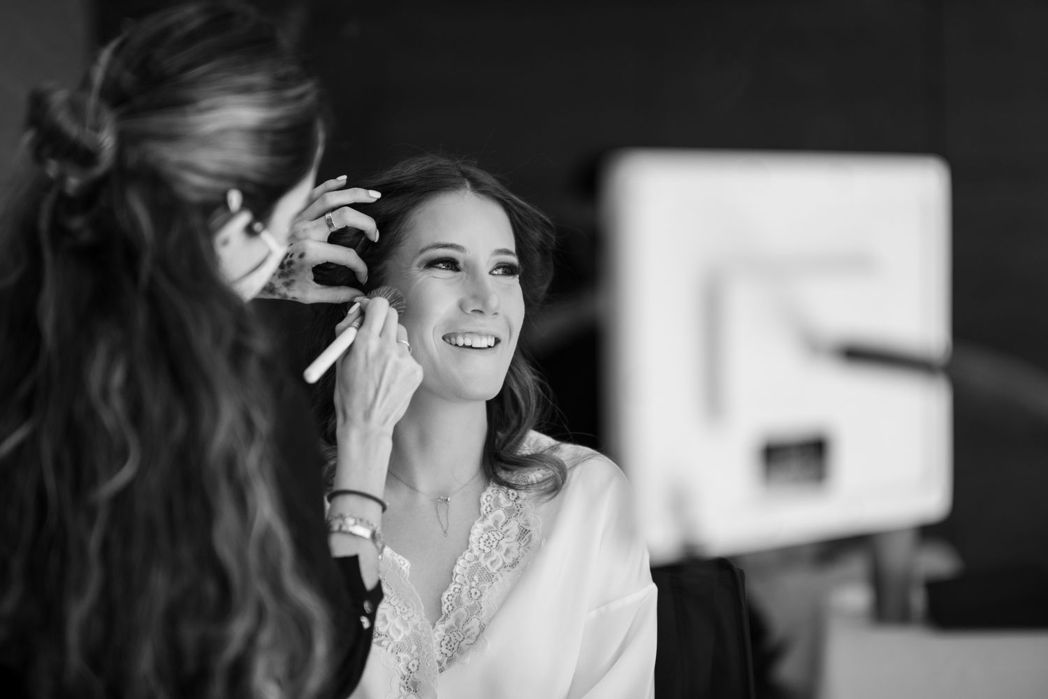 Behind the scenes shot during bridal makeup preparation.