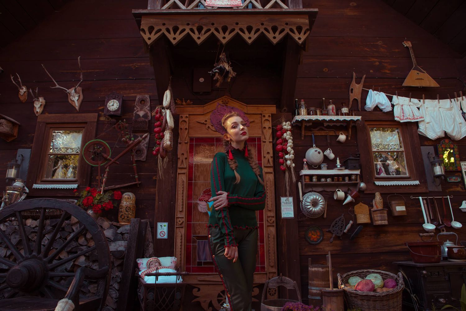 Whimsical scene of rustic cabin interior decorated with vintage items and holiday decor.