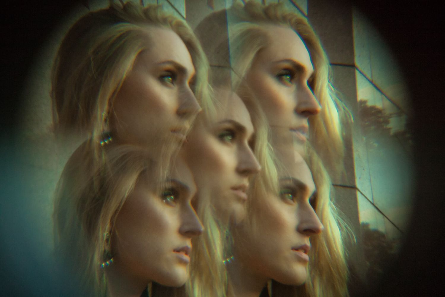 Kaleidoscopic fashion portrait with mirrored reflections creating symmetrical pattern.